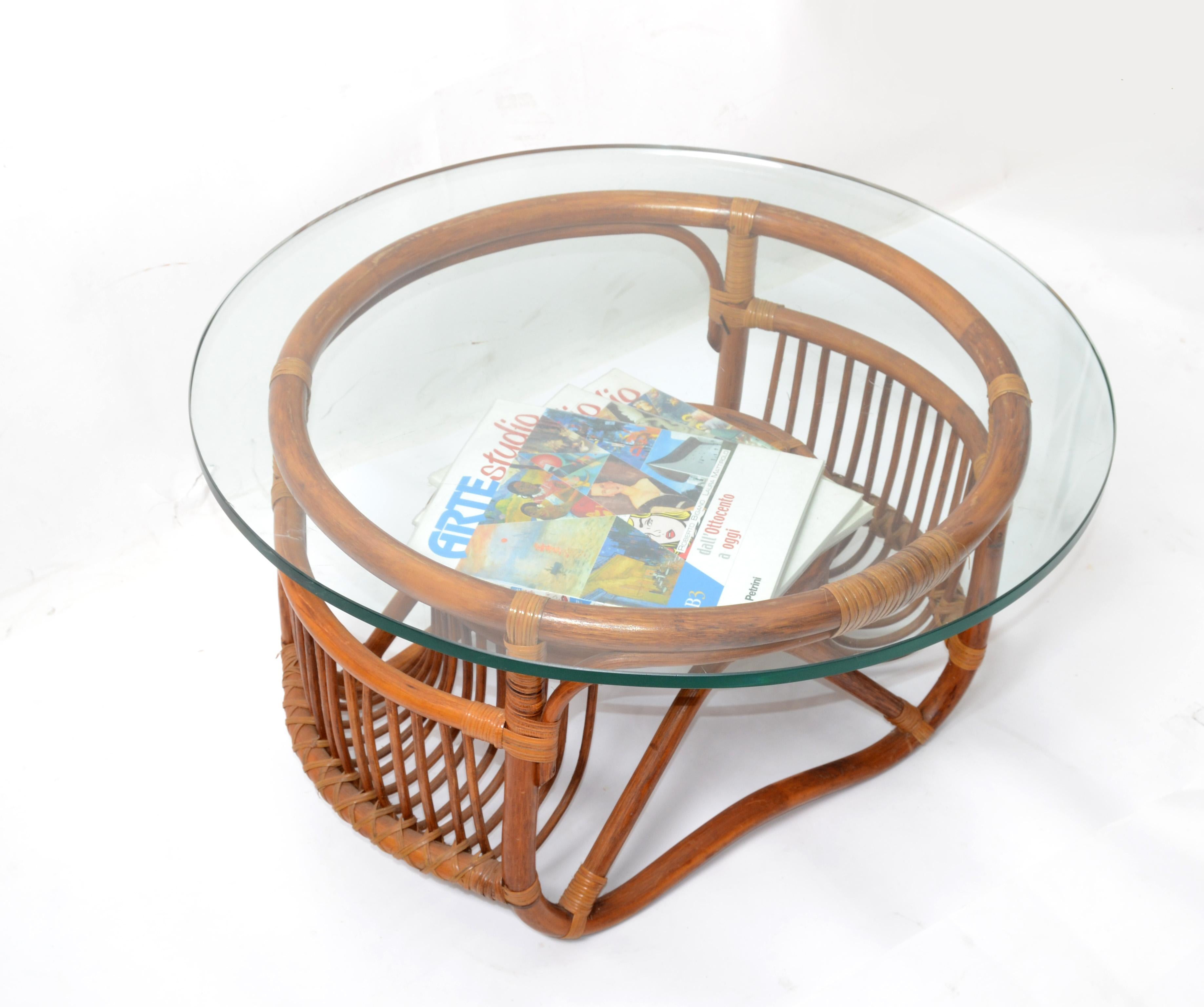 Sculptural bend bamboo wood coffee table, magazine stand handwoven with cane bindings and comes with a 0.5 inches thick round glass top.
Mid-Century Modern Boho Chic Design for a Sunroom or Your Florida Home.
In good original Condition with some