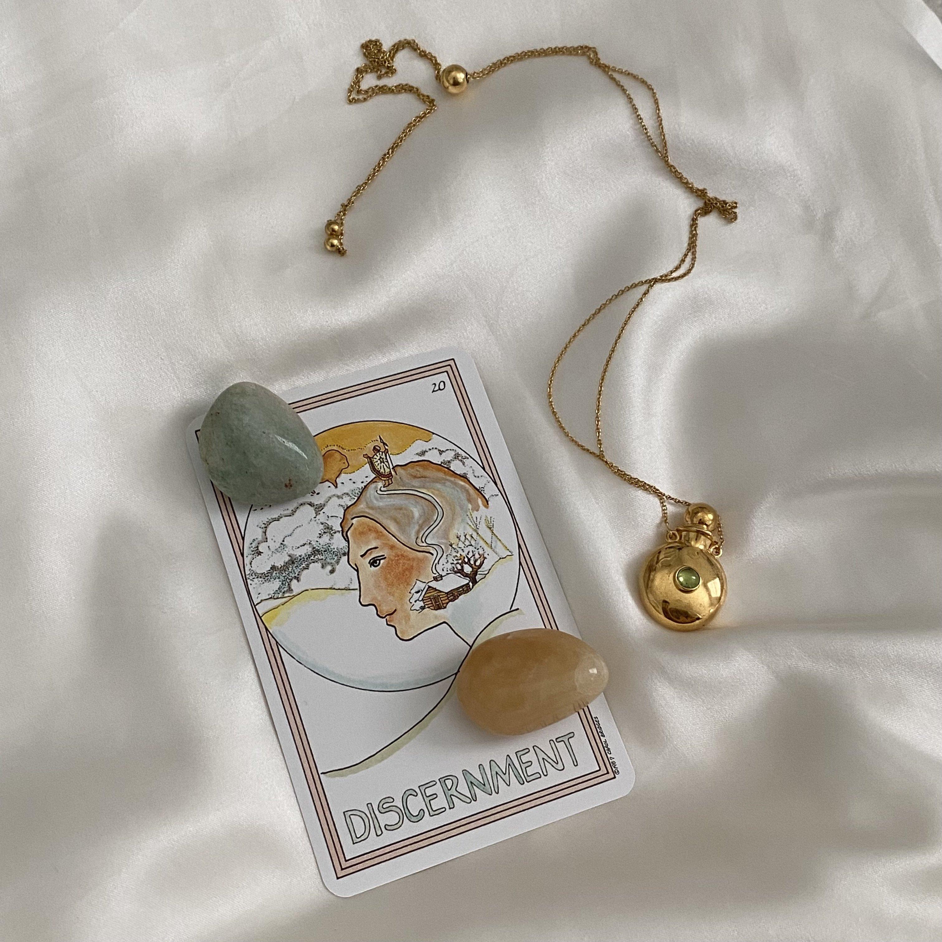 The classic rounded style outside is on the front and back, accented with a round semiprecious cabochon stone. Its hollow inside can bring your favorite perfume or essential oil wherever you go. 

Metals: 18K Gold vermeil with moss peridot or