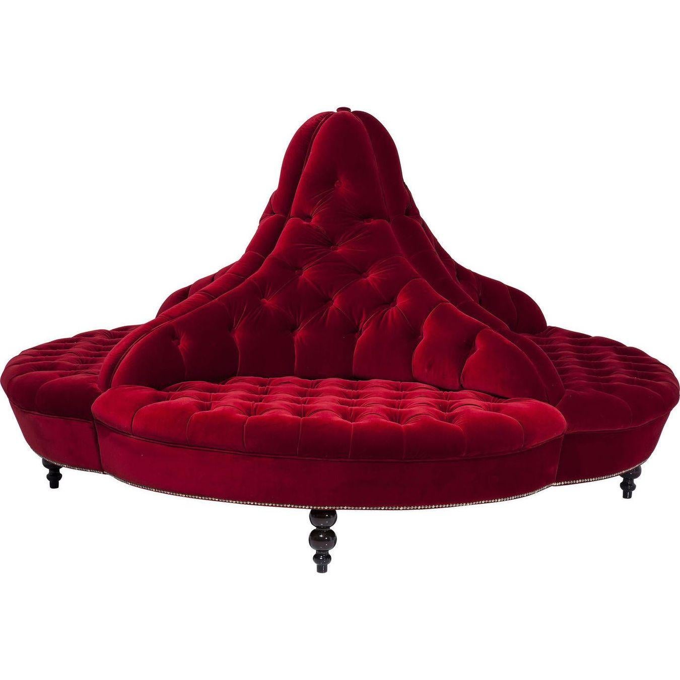 Four generously sized seats create a round, impressively shaped round sofa that comfortably seats four people. Lush upholstered and equipped with an extra soft velvet cover this sofa meets even the highest comfort standards. The continuous tufting,