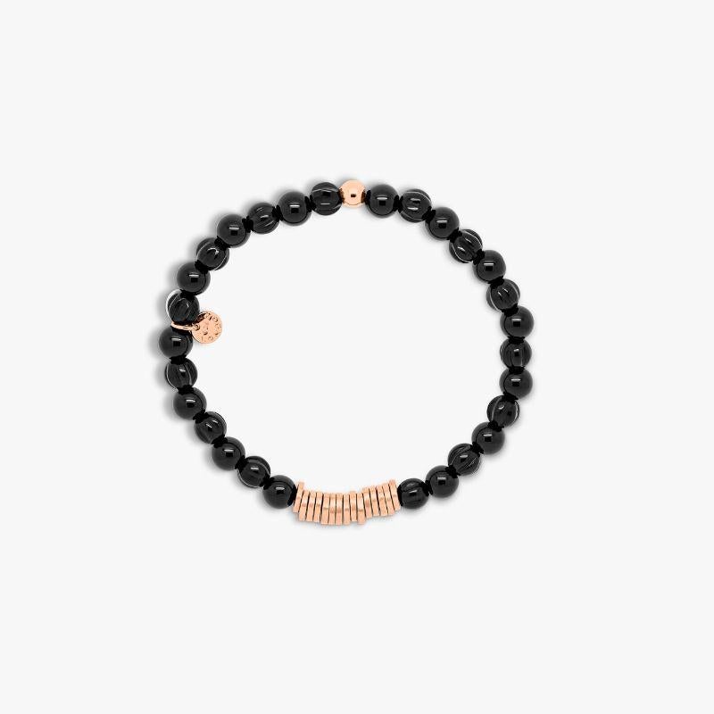 Discs Round bracelet with black agate and rose gold plated sterling silver, Size S

A series of bracelets featuring spherical semi-precious stone beads, separated by a group of irregularly finished 2 micron rose gold plated sterling silver disc