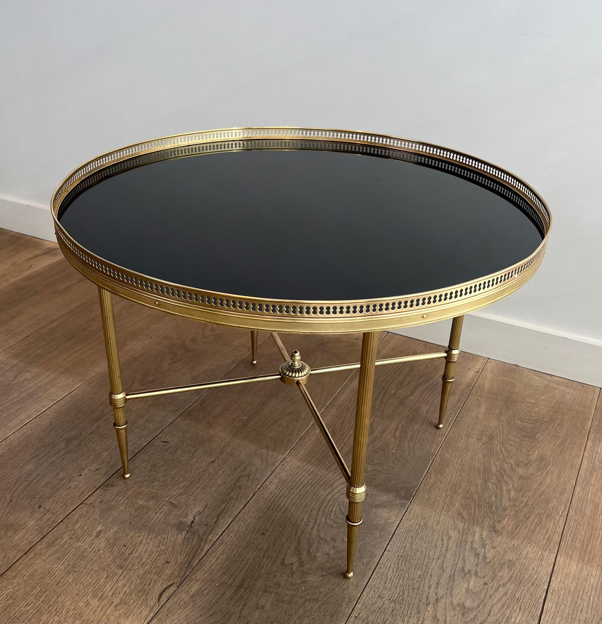 Neoclassical Round Brass Coffee Table with Black Lacquered Glass Top by Maison Jansen For Sale