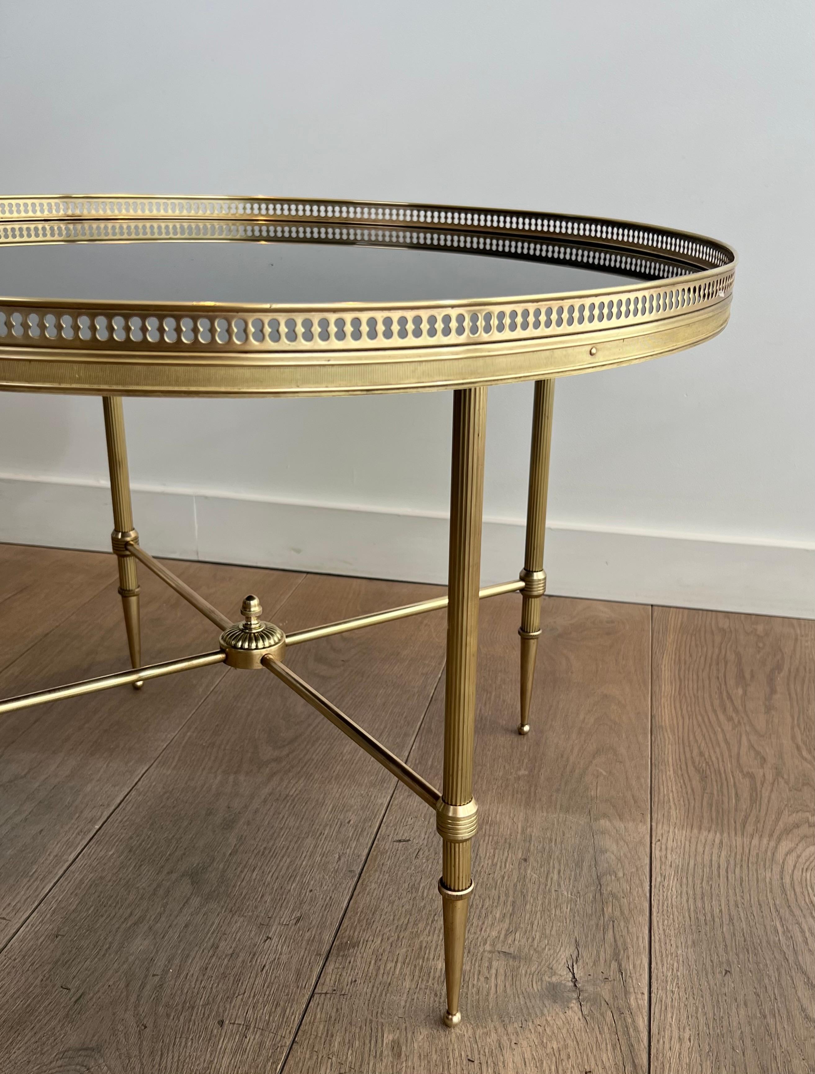 Mid-20th Century Round Brass Coffee Table with Black Lacquered Glass Top by Maison Jansen For Sale