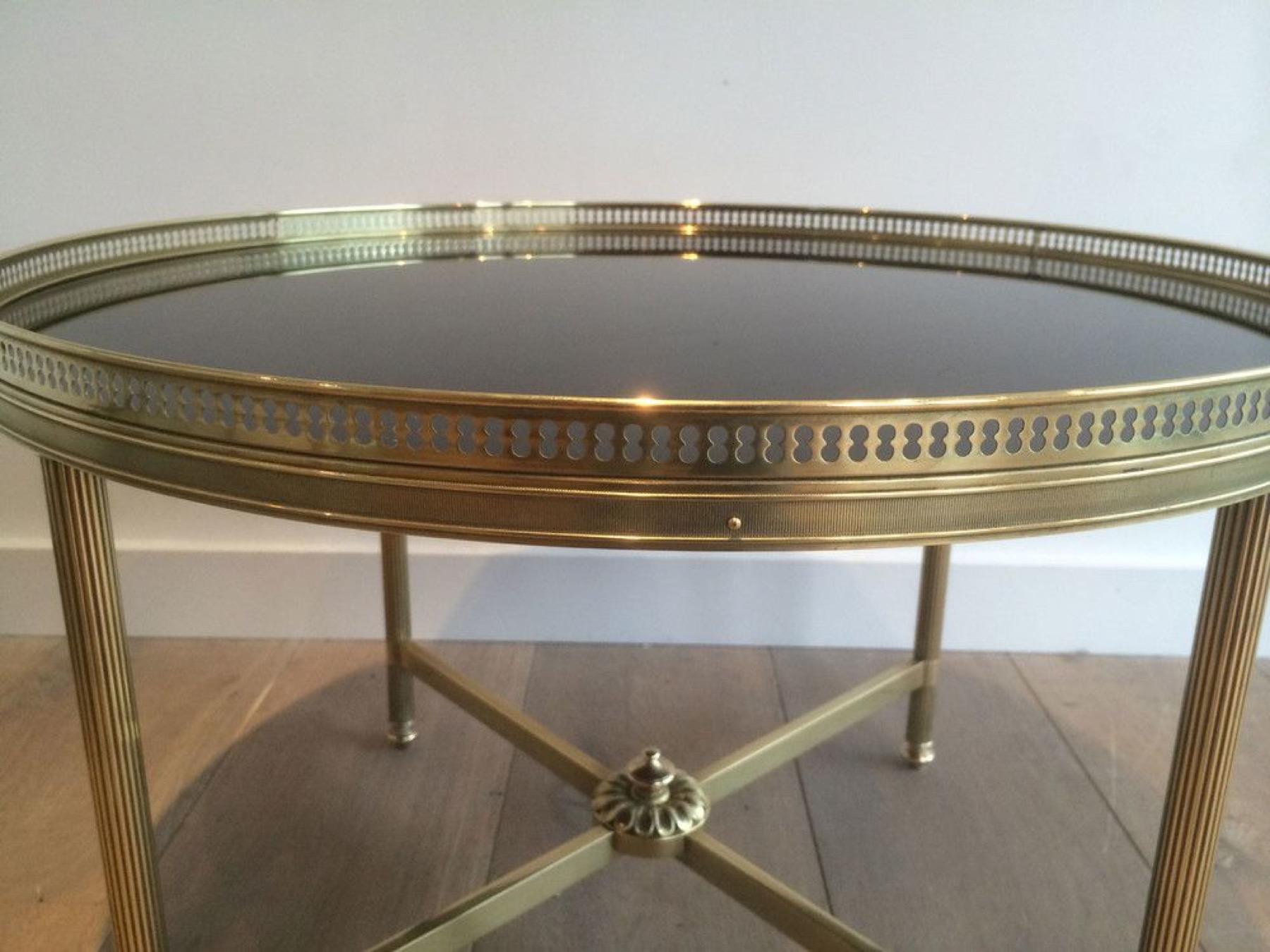 Mid-20th Century Round Brass Coffee Table with Black Lacquered Glass Top by Maison Jansen For Sale