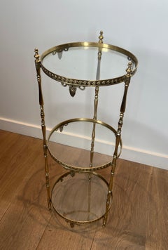 Round Brass Gueridon with Three Glass Shelves. French work by Maison Jansen