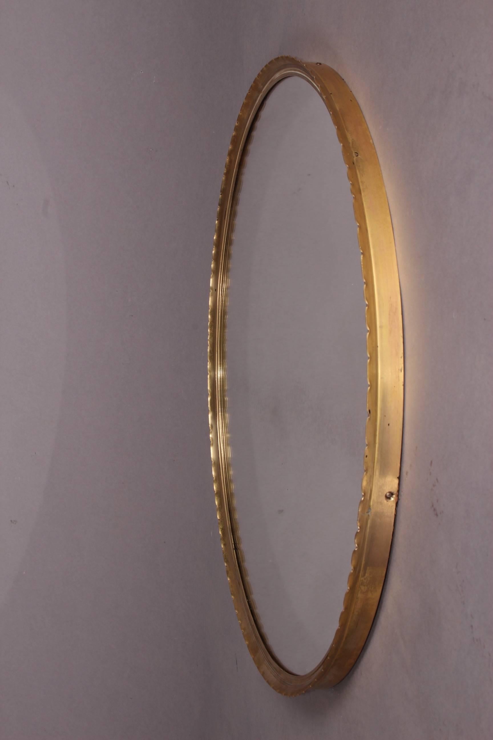 Round brass Josef Frank style mirror.