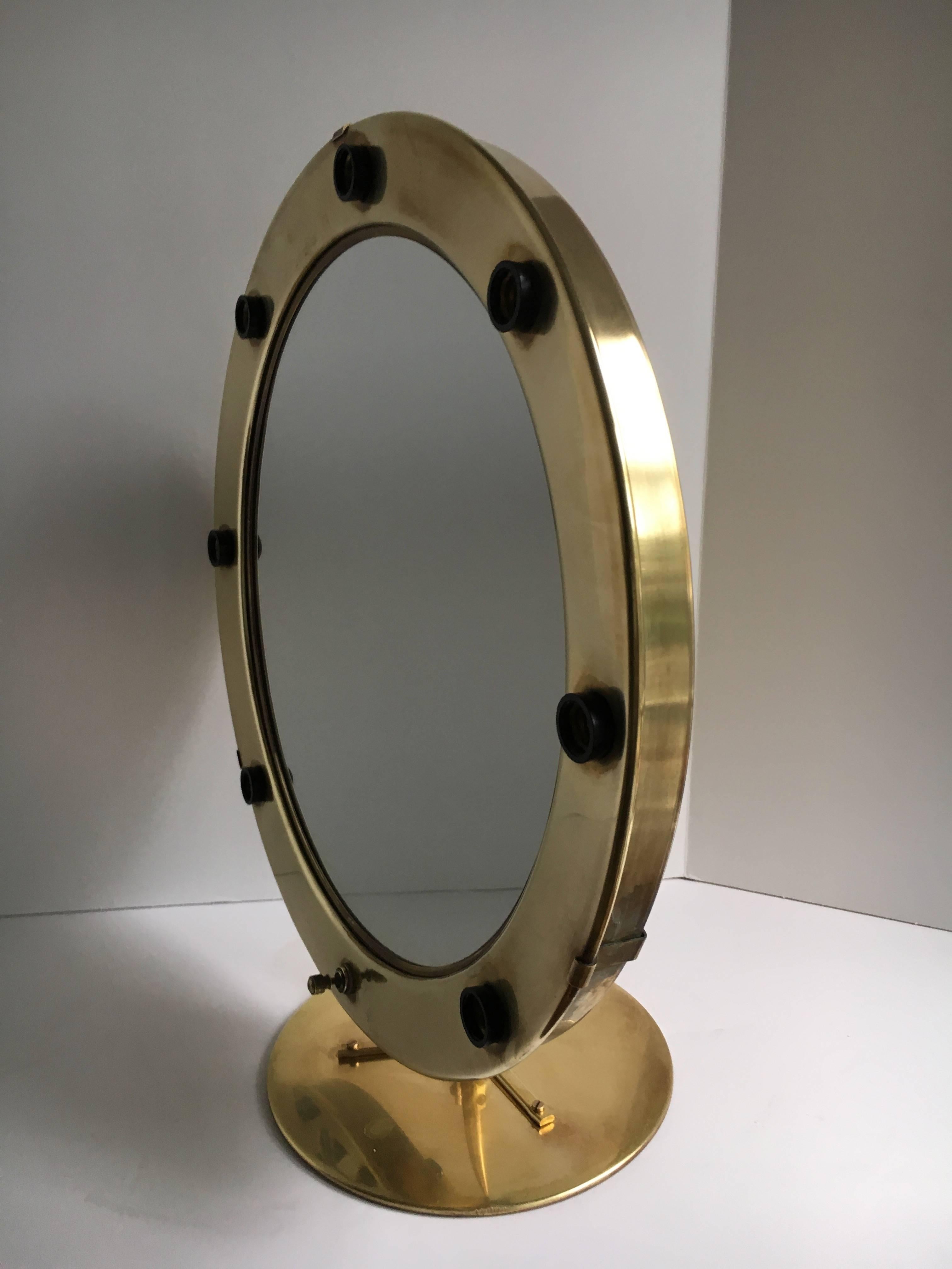 Round brass magnifying Hollywood makeup vanity mirror - a beautiful vanity mirror, this mirror only has magnifying. But the presentation is beautiful - for any woman that needs help seeing better or for actresses / models, this piece will allow you