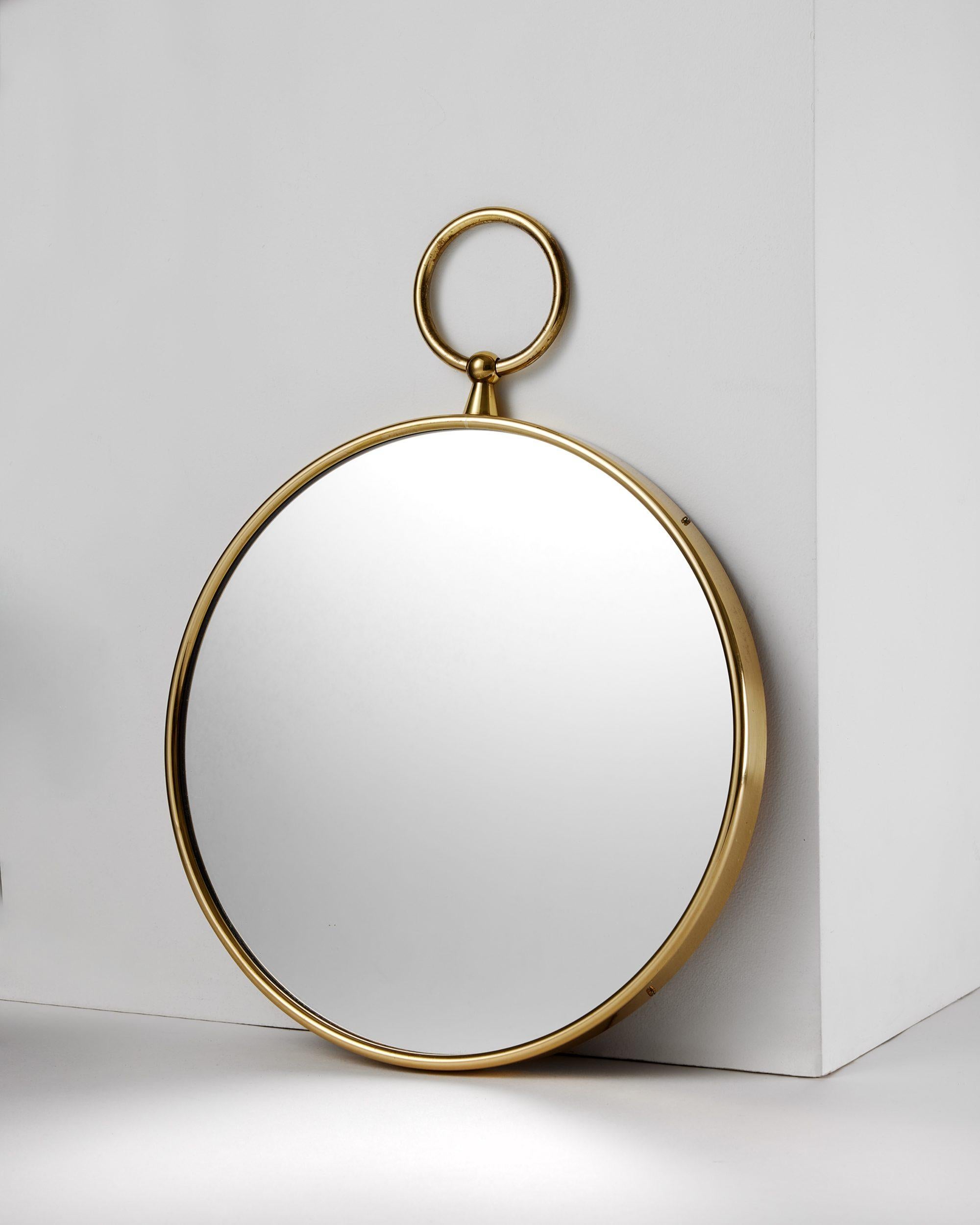 Mid-Century Modern Round brass mirror designed by Piero Fornasetti for Svenskt Tenn, Sweden, 1980s For Sale