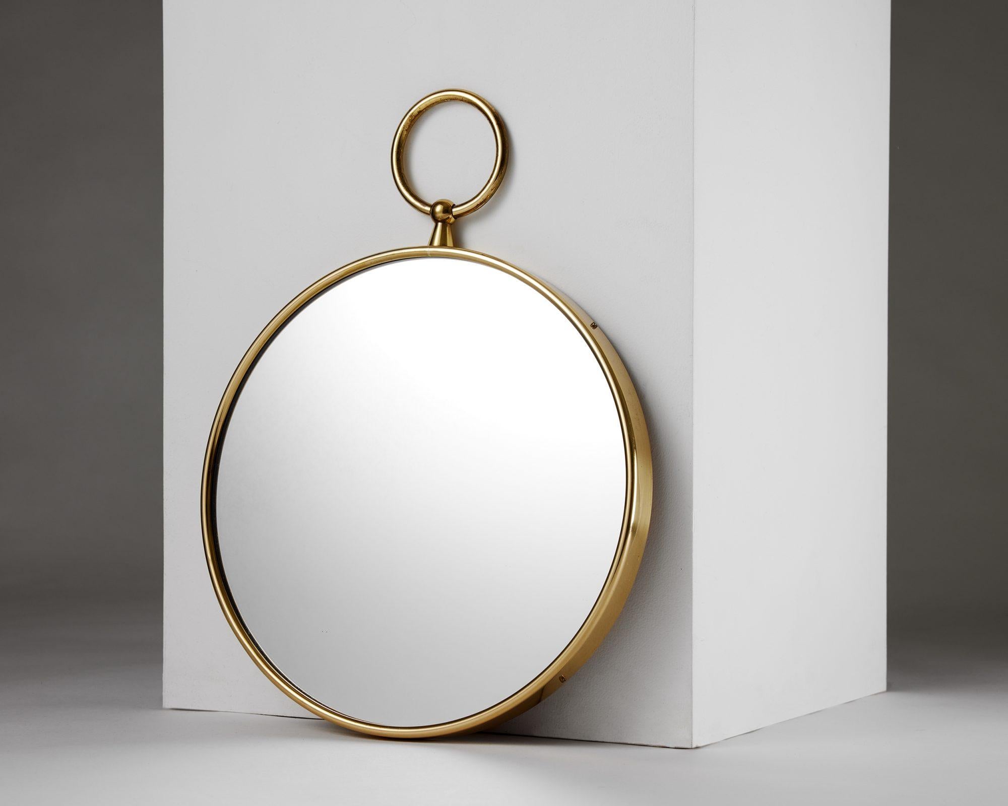 Swedish Round brass mirror designed by Piero Fornasetti for Svenskt Tenn, Sweden, 1980s For Sale