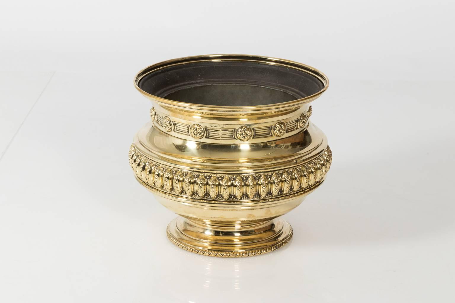 Round brass planter with liner in a polished finish, circa 20th century.
 