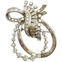 Vintage Round Brilliant and Baguette Diamond Platinum Double Bow Pendant Brooch