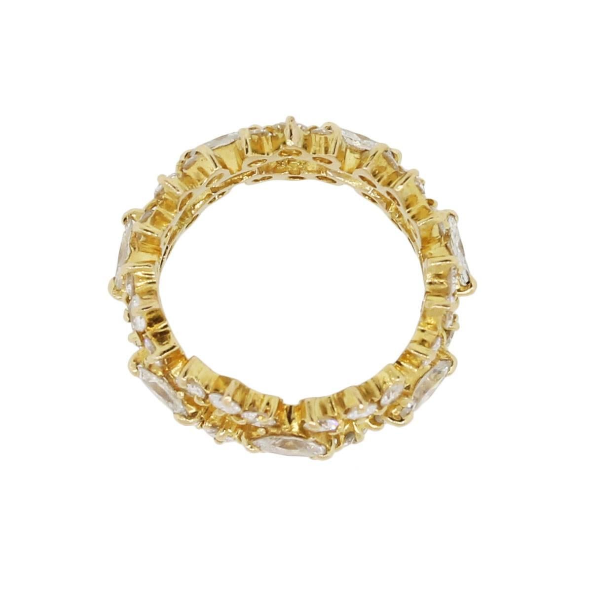 Material: 18k yellow gold
Diamond Details: Approximately 1.95ctw of round brilliant and marquise shape diamonds. Diamonds are G/H in color and VS in clarity
Size: 6.25
Total Weight: 6.4g (4.1dwt)
Measurements: 0.94″ x 0.40″ x 0.94″
Additional
