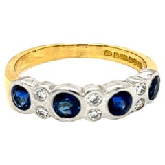 Round Brilliant Blue Sapphire and Diamond 18 Karat Gold Band Ring