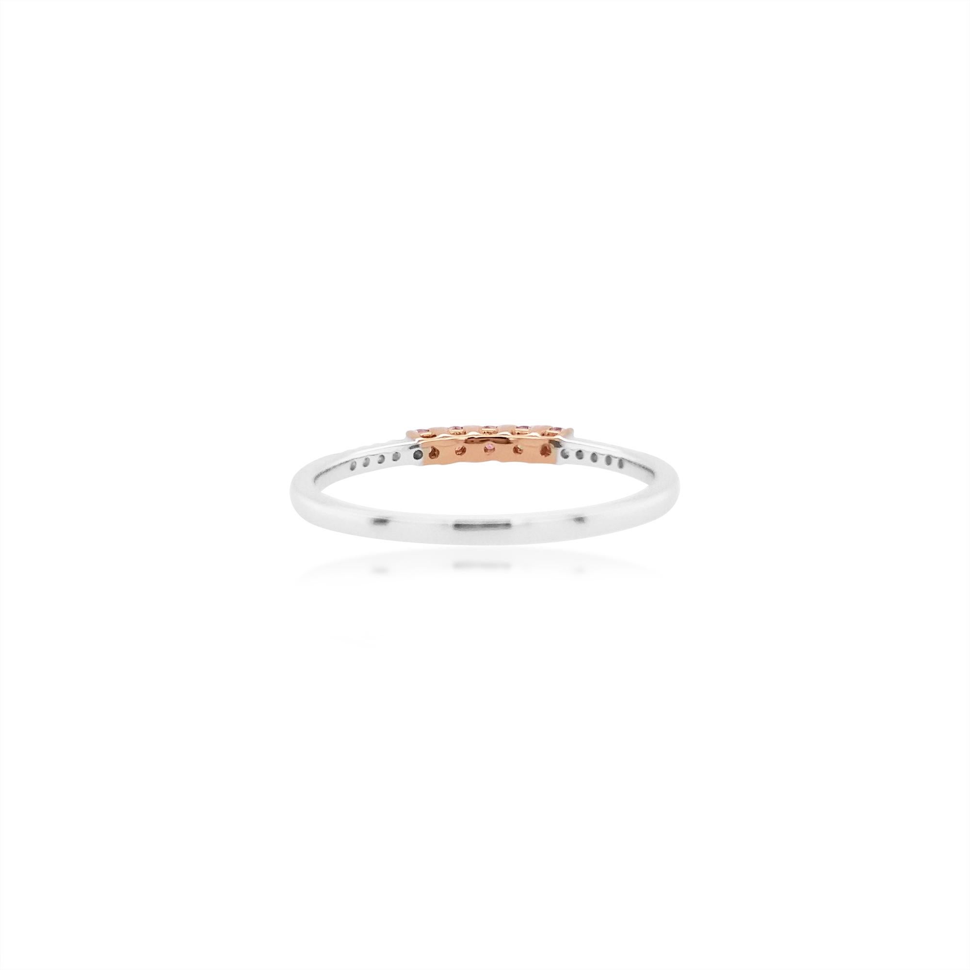 Stylish Band ring with a beautiful line of Rare Argyle Pink diamonds styled with white diamonds, made in 18 K Gold

Round Brilliant Cut Natural Pink Diamonds - 0.12 cts
Round Brilliant Cut White Diamond - 0.05 cts
Made in Gold

HYT Jewelry is a Fine