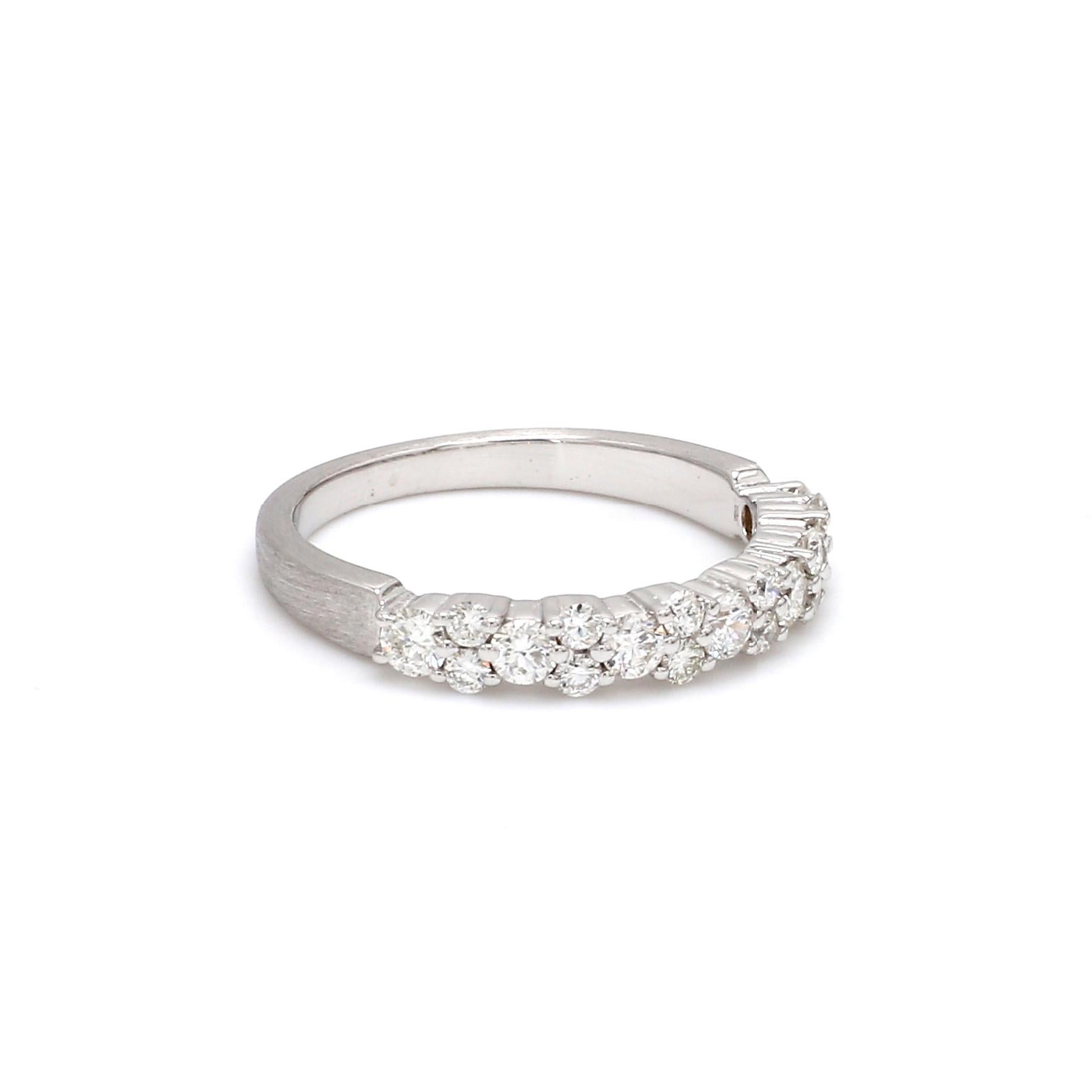 A Beautiful Handcrafted Ring in 18 Karat White Gold with Graduated Natural Brilliant Cut Round Diamond . A perfect Wedding Band for the Special occasion. The Band is finished in satin

Natural Diamond Details
Pieces :  19 Pieces
Weight : 0.68 Carat