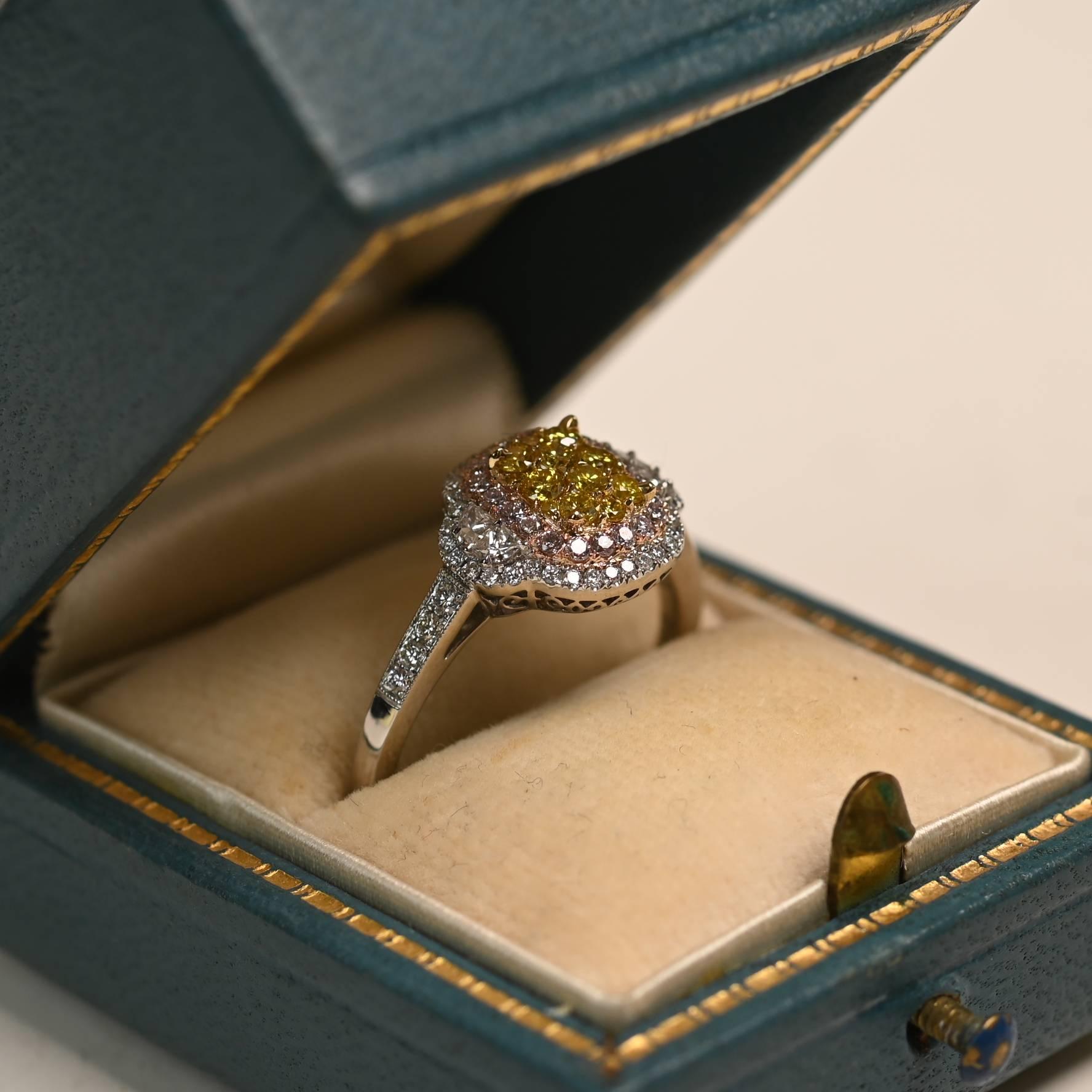 This exquisite platinum ring showcases a vibrant cluster of round brilliant yellow diamonds, weighing approximately 0.20 carats in total, each set in 18k yellow gold prongs. Encircling the center is a striking double halo: the inner row features 18k
