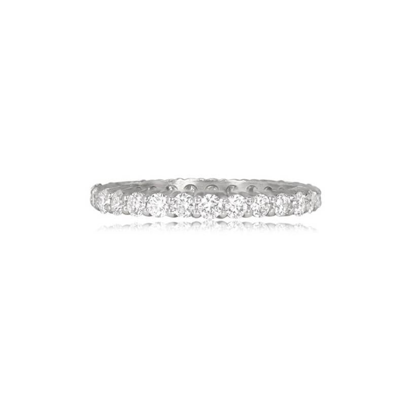 A sophisticated platinum ring adorned with round brilliant-cut diamonds meticulously set in a shared-prong style along the band. The width of this elegant ring is 2.4mm, creating a timeless and refined piece.

Ring Size: 7 US, Resizable
Metal:
