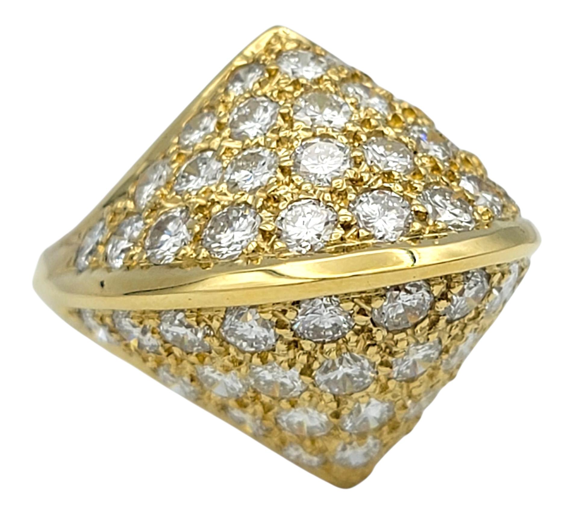 This dazzling diamond ring makes a bold and elegant statement. The round brilliant cut diamonds radiate extraordinary fire and brilliance, their icy-white sparkle complemented by impressive clarity that ensures a luxurious presence. Carefully set to