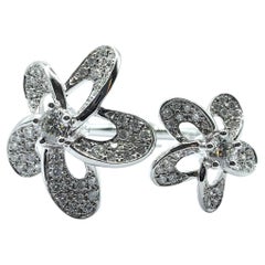 Anello aperto con motivo floreale in oro bianco 18 carati con diamante taglio brillante rotondo