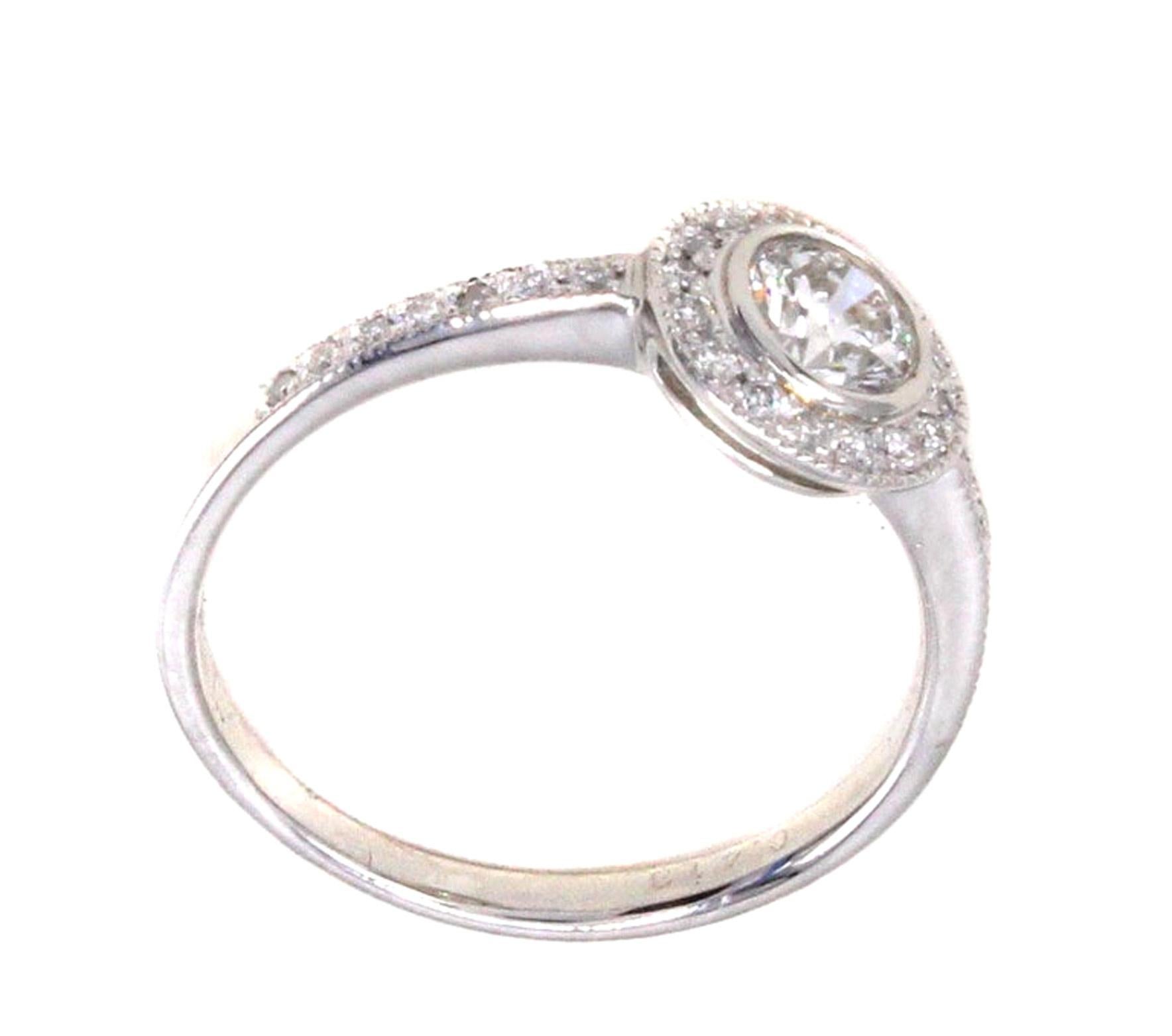 Contemporary Round Brilliant Cut Diamond Platinum Halo Engagement Ring For Sale