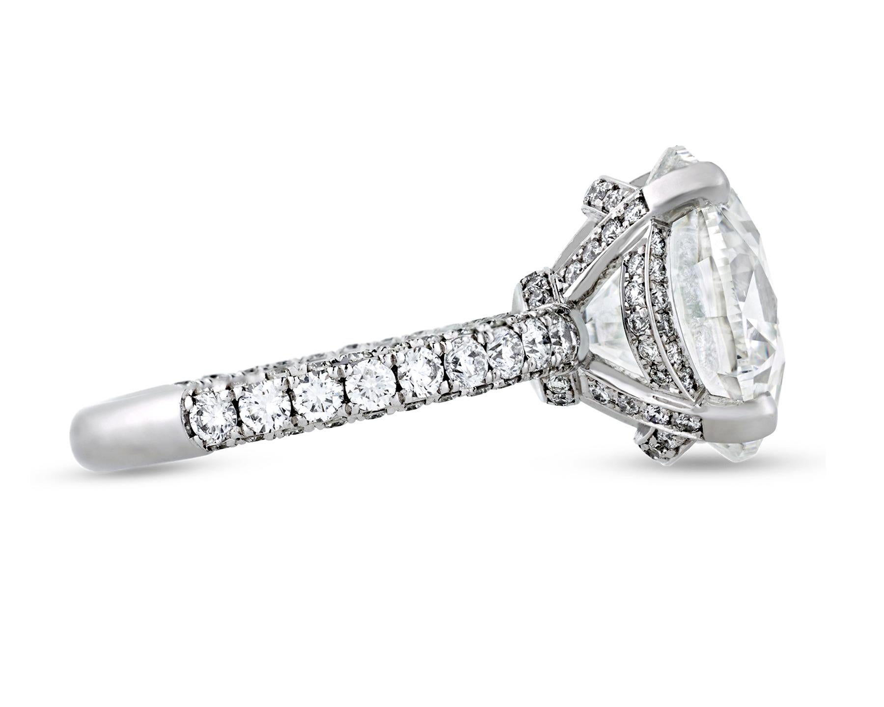 This eye-catching diamond ring bears a phenomenal and rare 9.07-carat round brilliant-cut white diamond as its shining centerpiece. Certified by the Gemological Institute of America (GIA), this breathtaking ring achieves the outstanding F color and