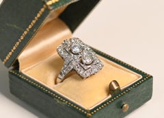 Elongated Platinum and Diamond Ring. 0.40ct Round Cut Halo Engagement I VS2-S1