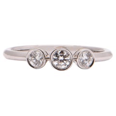 Round Brilliant Cut Diamond Trilogy Ring in 18 Carat White Gold