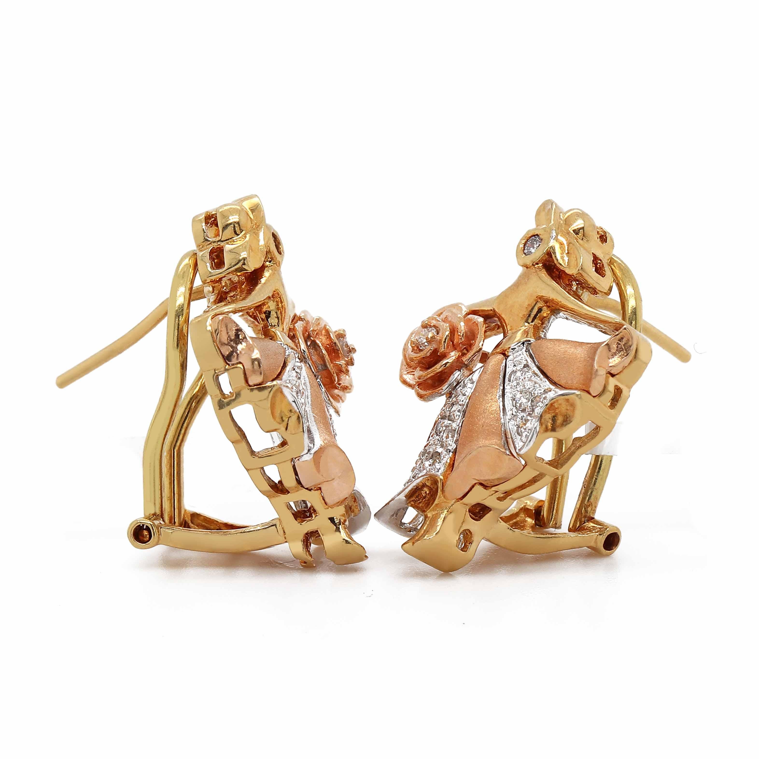 Diamond Earrings containing 24 round brilliant cut diamonds of about 0.32 carats with a clarity of SI and color H. All stones are set in 18k 2 tone gold. The total weight of the earrings is approximately 10.34 grams.