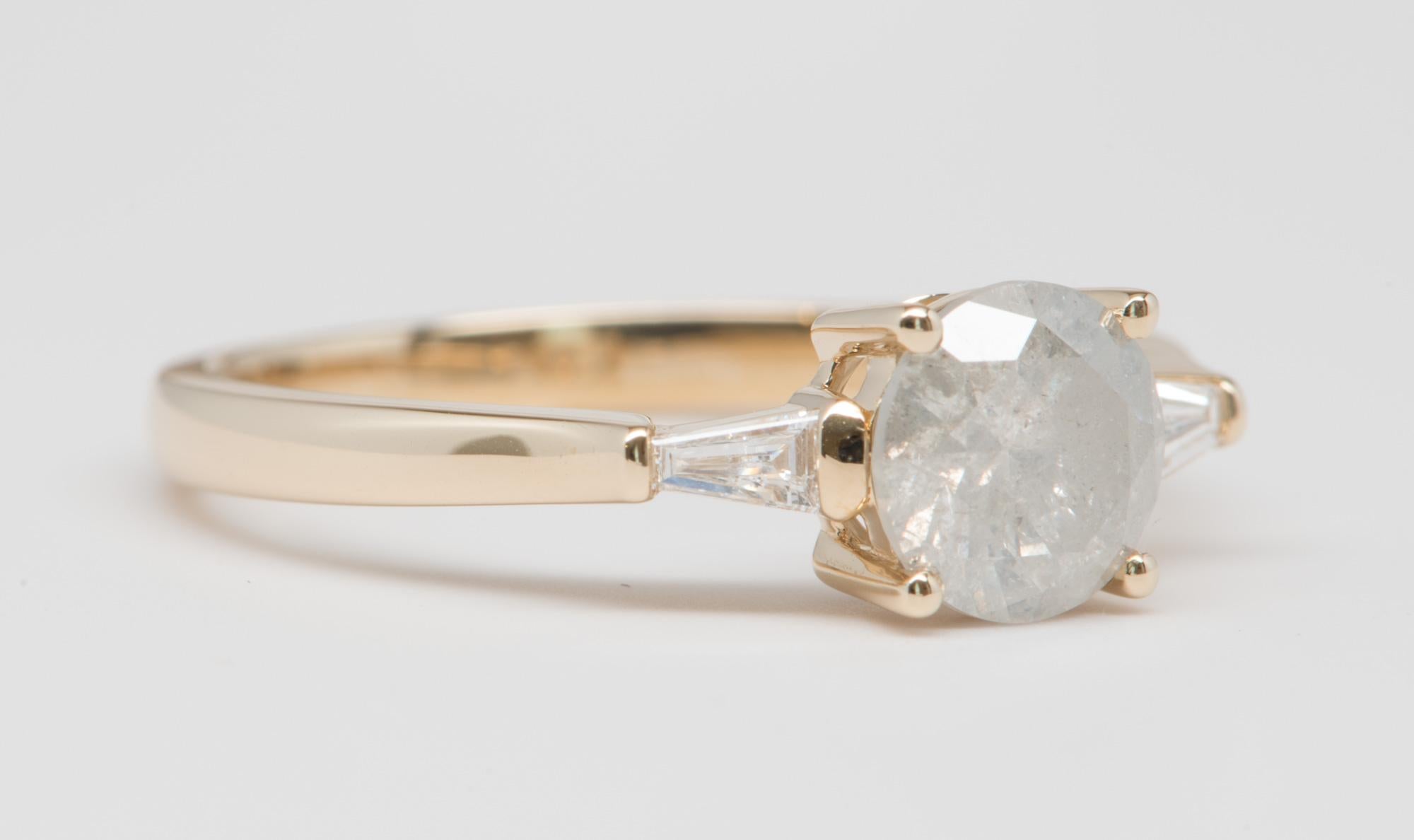 ♥  Solid 14K yellow gold ring set with a round brilliant cut milky white diamond center, flanked by tapered baguette diamonds on the side to complement the center stone
♥  The overall setting measures 14.2mm in width, 6.3mm in length, and sits 4.3mm