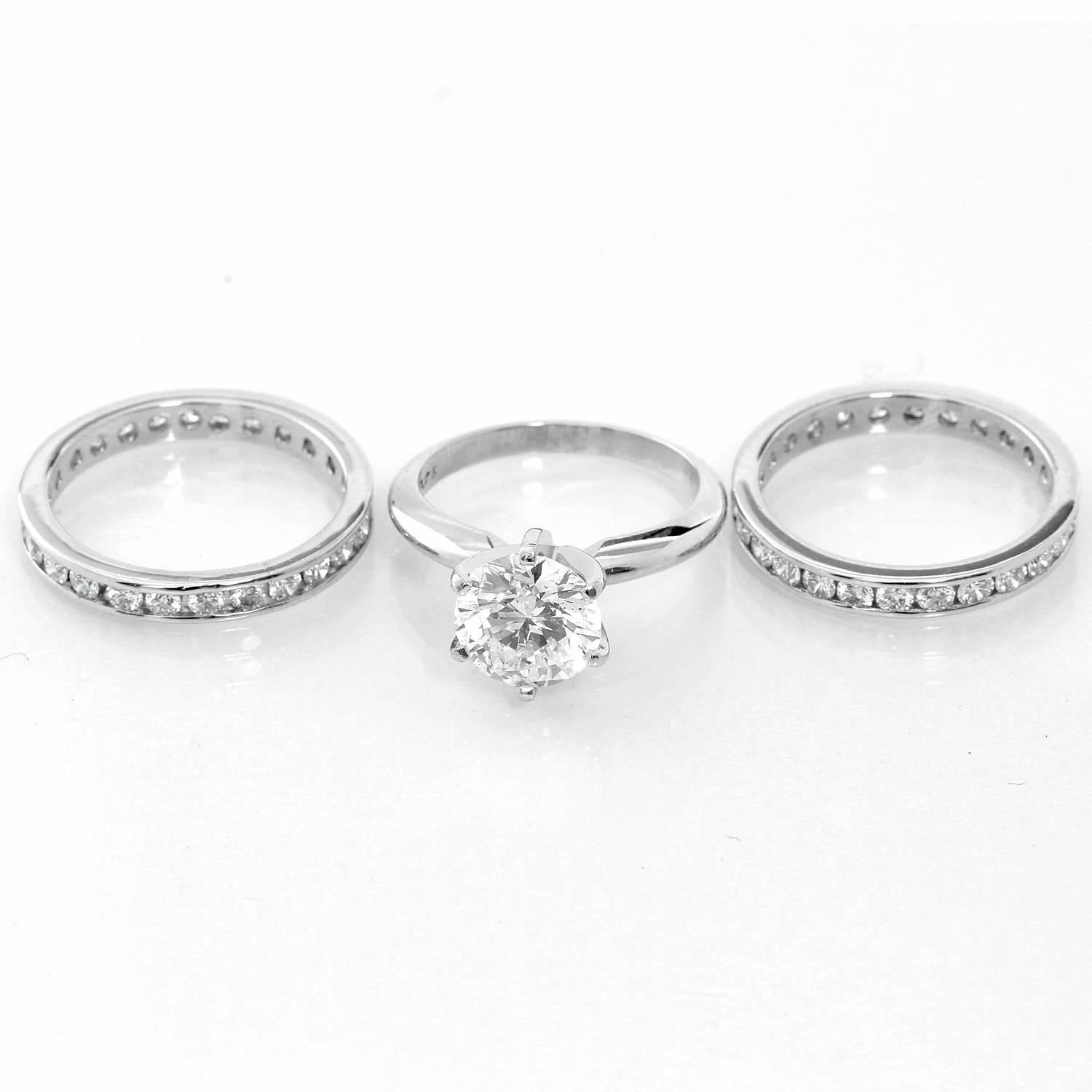 Round Brilliant Cut Solitaire and Diamond Bands - . Platinum Round Brilliant Cut Solitaire Diamond Ring Size 5 - . Stunning 1 Round brilliant solitaire diamond totaling 2cts. Diamond color E. Diamond Clarity S1-2. Total weight 5.4 grams. GIA