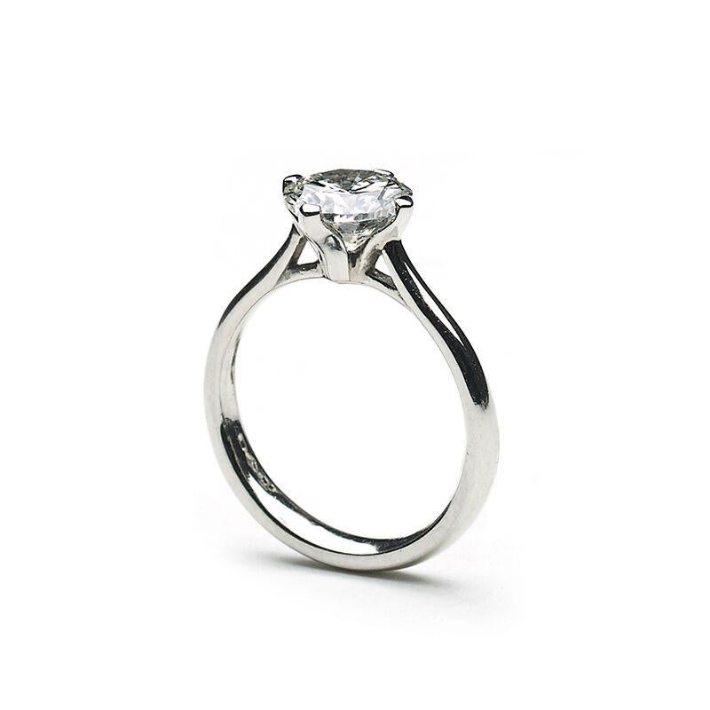 A solitaire diamond ring, set with a 2.00ct, H colour, VVS2 clarity, round brilliant-cut diamond, mounted in platinum, in a four claw setting, with tapered shoulders, accompanied by GCS certificate 79191-65.
Finger size N UK / 6½ USA.