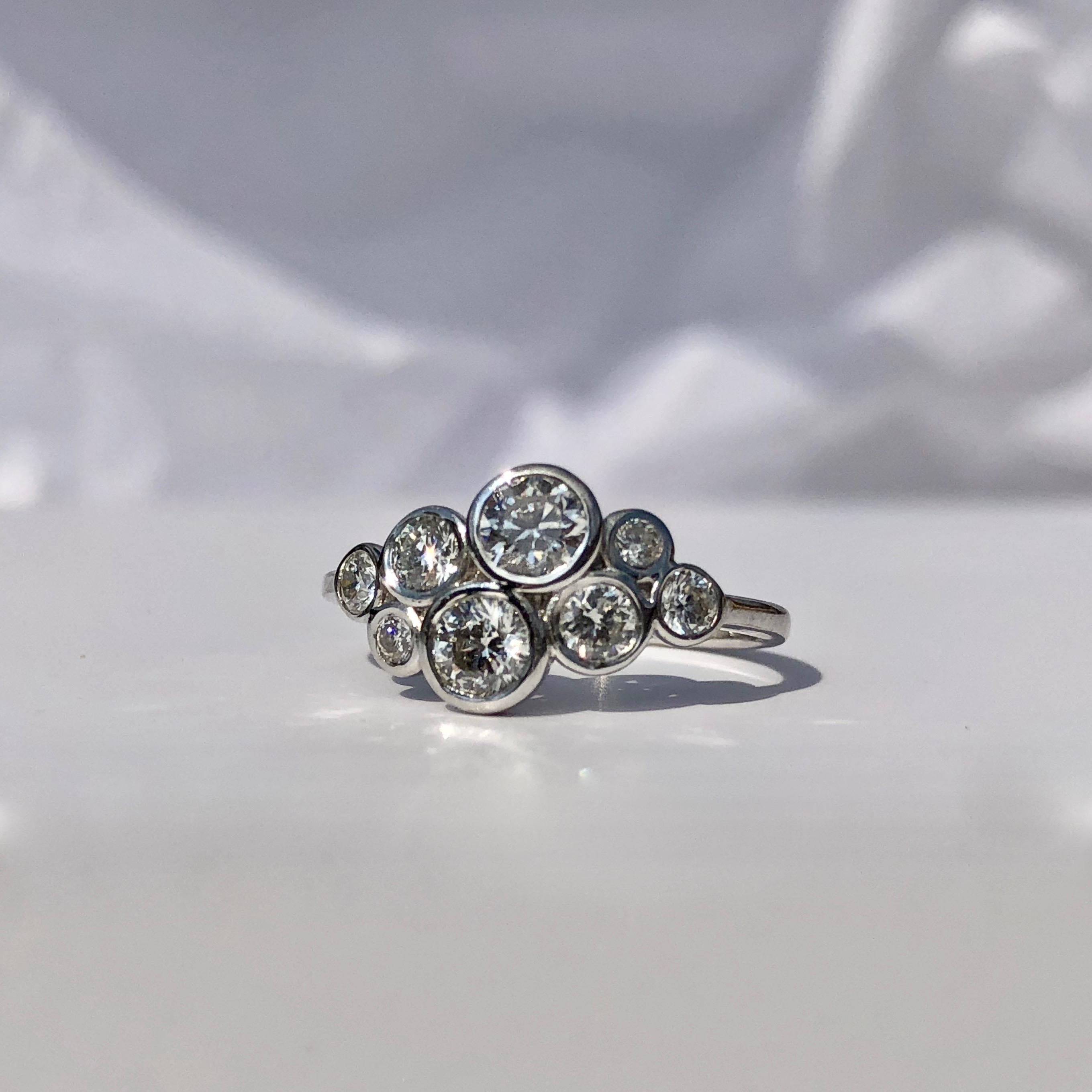 Round Brilliant Cut Diamond 18k White Gold Ring 

This amazing 'bubble' ring - a variation of pieces on the market in Tiffanys and Boddles - but with individuality !

I haven't seen another like it !

The diamonds are bright and lively - of H colour