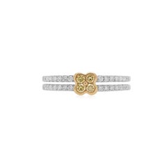 Anillo de oro de 18 quilates con diamante amarillo talla brillante redondo y diamante blanco