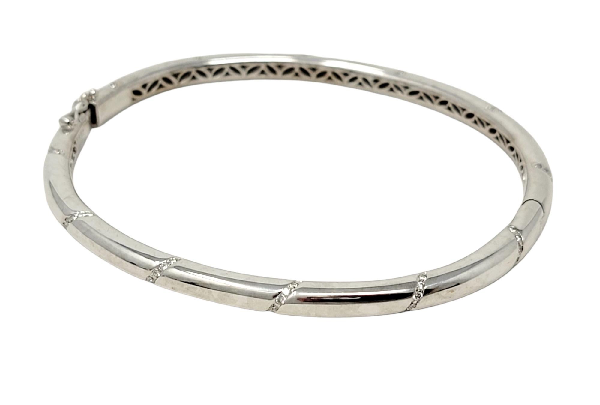 Contemporary Round Brilliant Diamond Accented Hinged Bangle Bracelet in 18 Karat White Gold For Sale