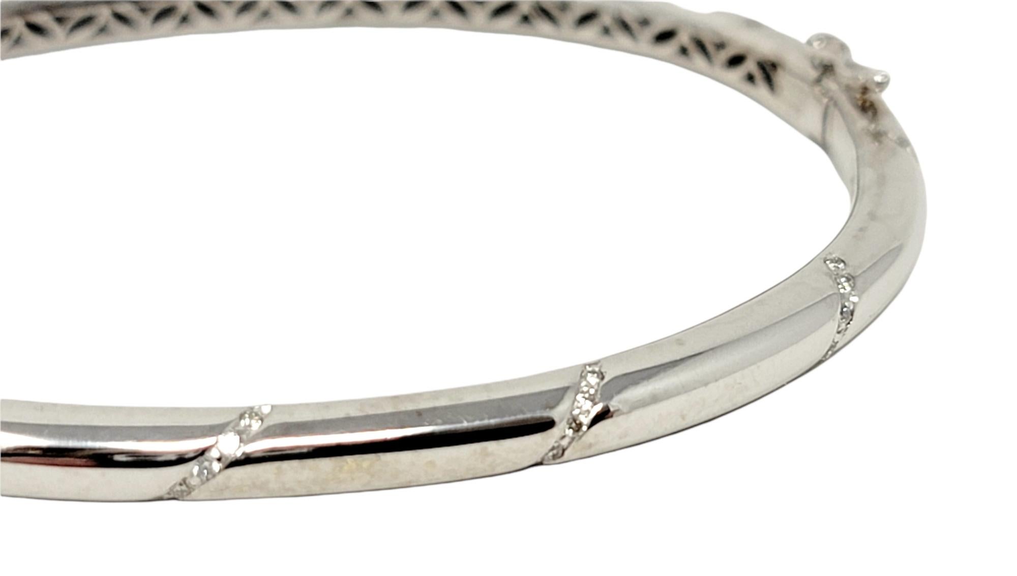 Women's Round Brilliant Diamond Accented Hinged Bangle Bracelet in 18 Karat White Gold For Sale