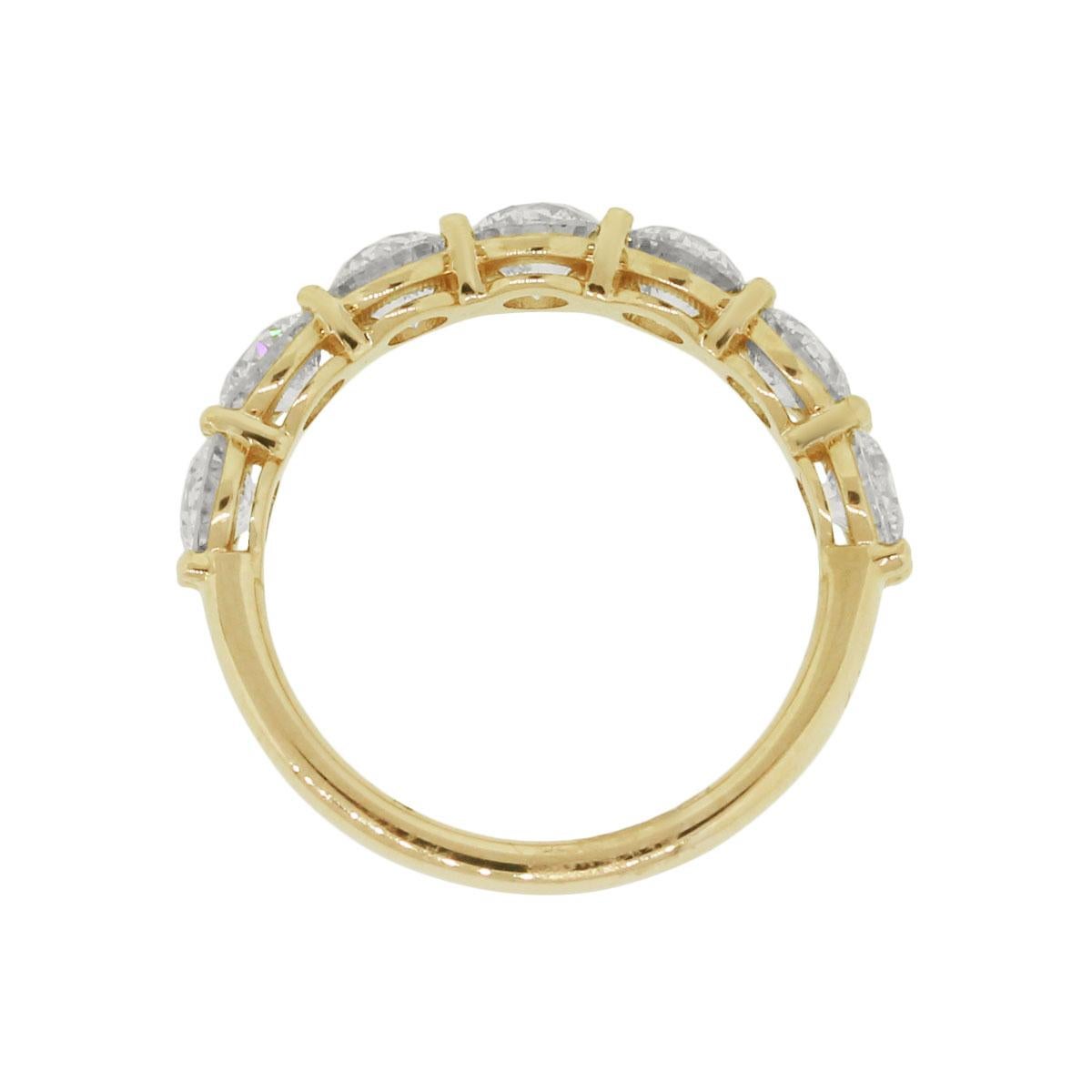 Material: 14k yellow gold
Diamond Details: Approximately 2.19ctw of round brilliant diamonds. Diamonds are G in color and VS in clarity.
Measurements: 0.84″ x 0.17″ 0.89″
Ring Size: 6.50
Item Weight: 3.3g (2.1dwt)
Additional Details: This item comes