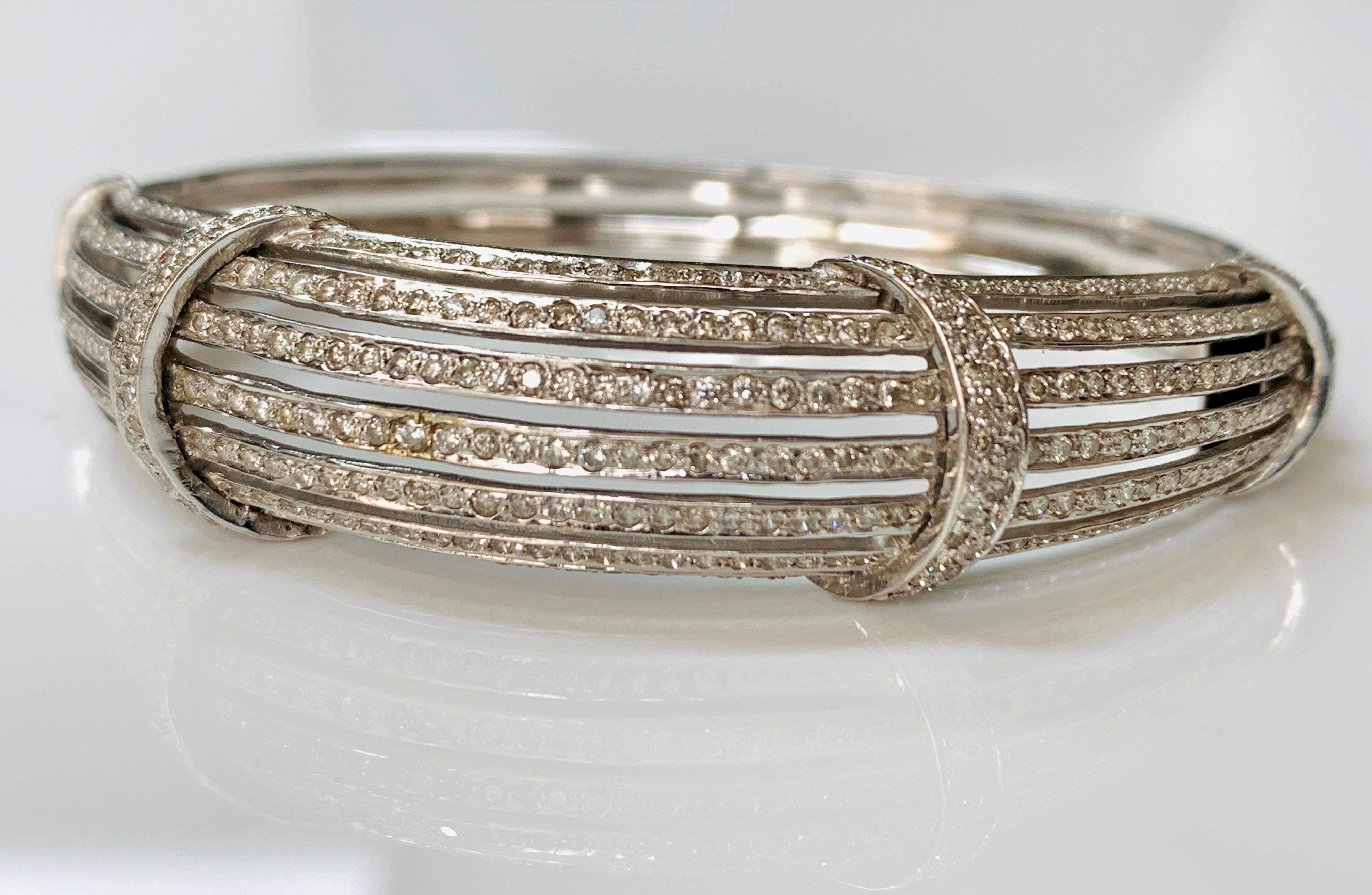 This beautiful diamond bangle bracelet is handcrafted in 18 K white gold. The details are as follows : 
Diamond weight : 2.50 carat ( GH color and VS clarity ) 
Metal : 18 K white gold 
Measurements : 6 1/2 
Gold Weight : 26.700 grams 
