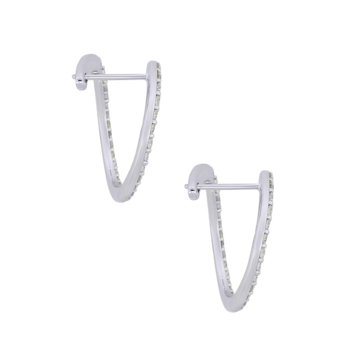 Material: 14k white gold
Diamond Details: Approximately 0.68ctw of round brilliant diamonds. Diamonds are G/H in color and SI in clarity.
Measurements: 0.70″ x 0.42″ x 0.71″
Earring Backs: Hinge
Total Weight: 3g (1.9dwt)
Additional Details: This