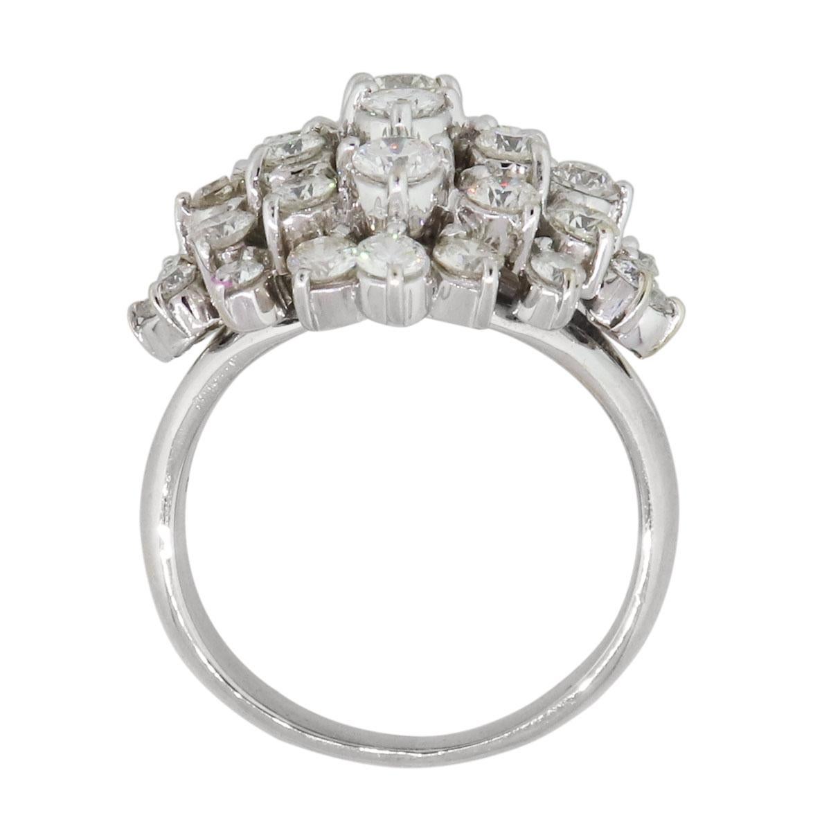 Material: 18k white gold
Diamond Details: Approximately 2.50ctw of round brilliant diamonds, 34 stones. Diamonds are G/H in color and VS in clarity
Ring Size: 6.75 (can be sized)
Ring Measurements: 1.04″ x 0.87″ x 0.83″
Total Weight: 9.9g