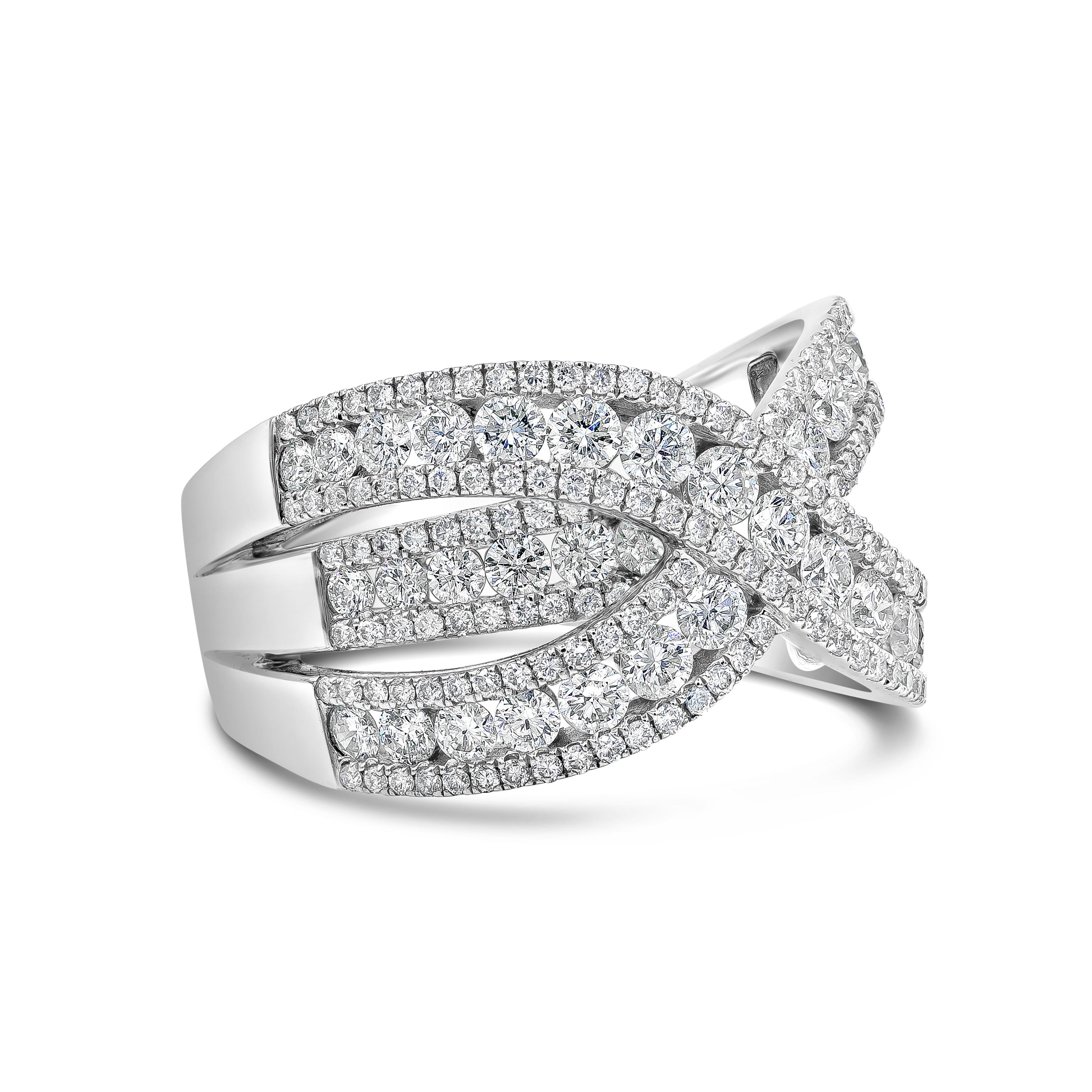 A brilliant and chic fashion ring showcasing three rows of round brilliant diamonds channel set in a diamond encrusted white gold mounting. Two rows cross in the middle of the ring and Diamonds weigh 2.42 carats total. Made in 18K White Gold and