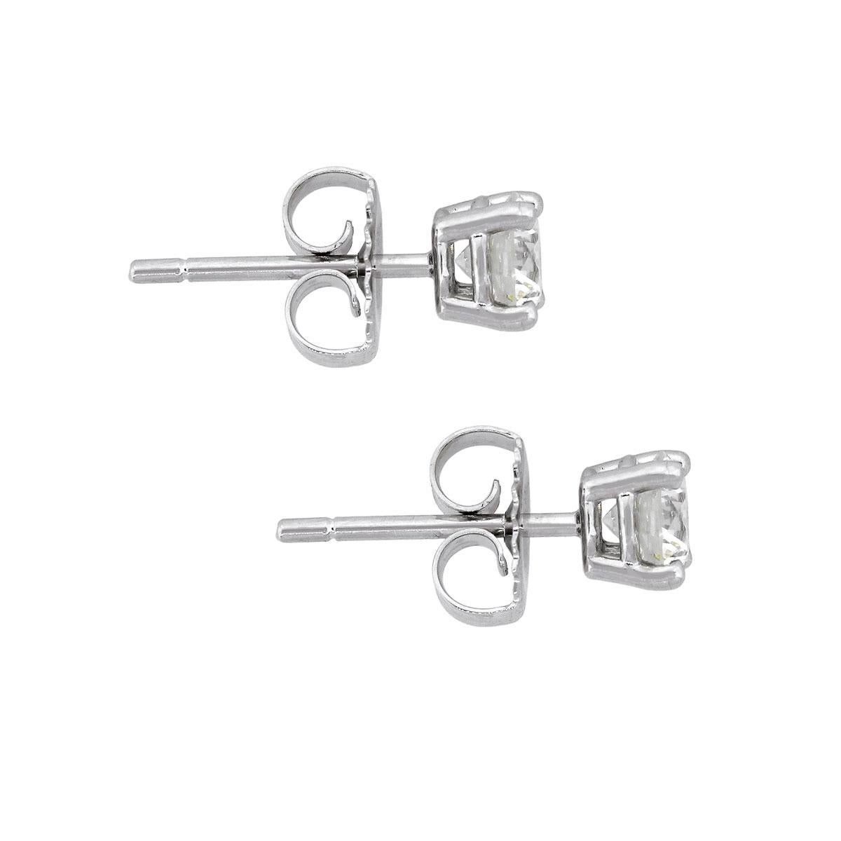 Material: 14k white gold
Diamond Details: Approximately 1.01ctw of round brilliant diamonds. Diamonds are I/J in color and SI in clarity.
Measurements: 0.61″ x 0.26″ x 0.26″
Earring Backs: Tension post
Total Weight: 1.3g (0.8dwt)
SKU: A30312436