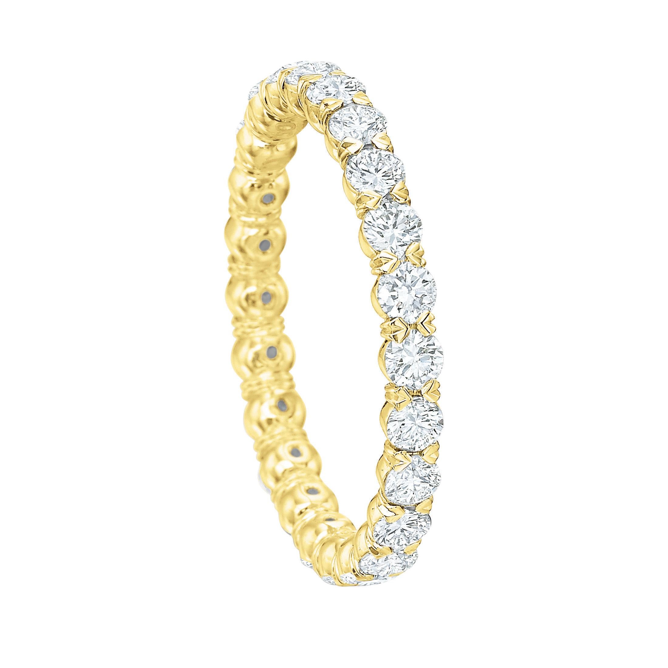 Diamond eternity band ring, showcasing round brilliant-cut diamonds set with shared prongs in a sculpted 18k yellow gold mounting.

Twenty-four diamonds weighing 1.18 total carats
2.5mm wide
Size 6