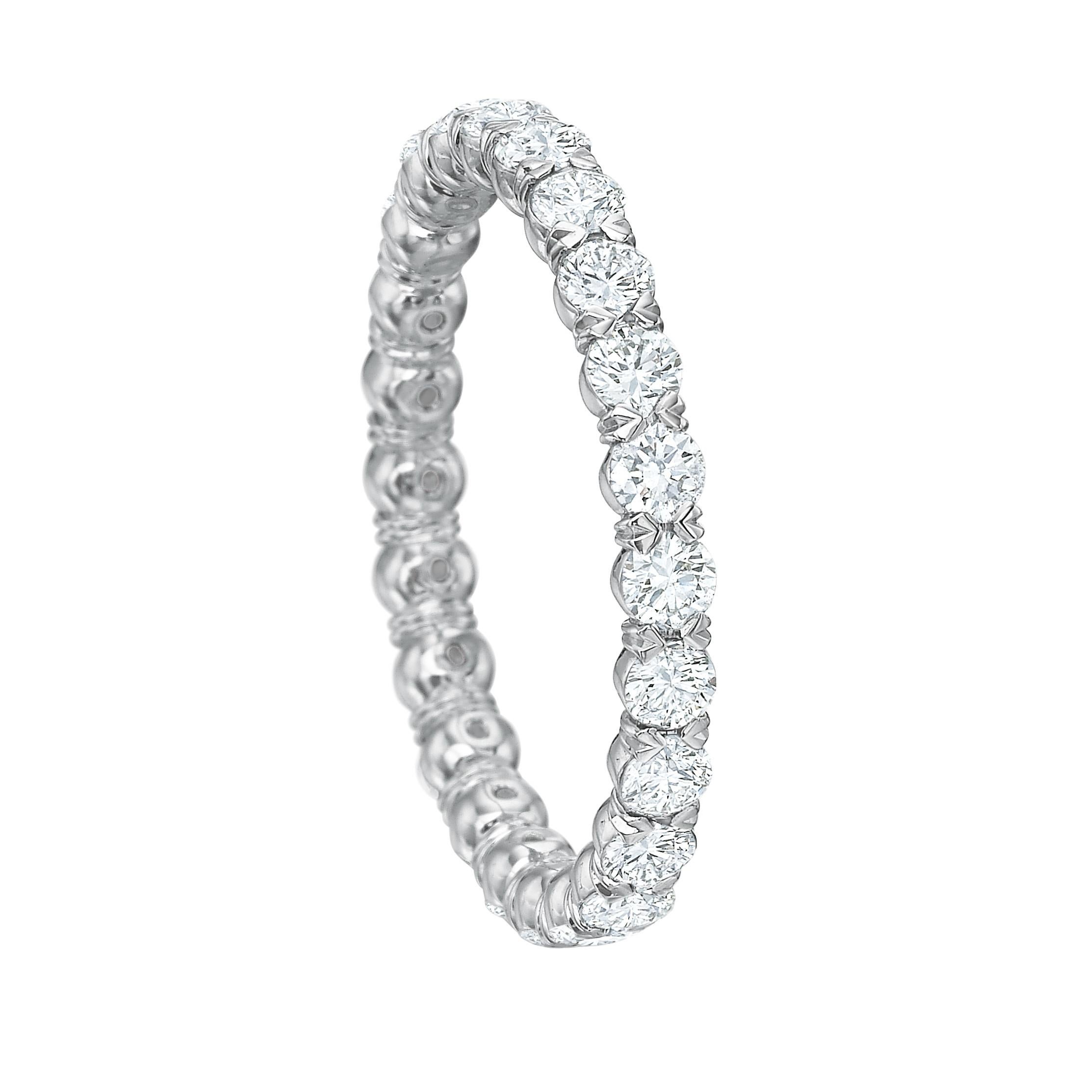 Diamond eternity band ring, showcasing round brilliant-cut diamonds set with shared prongs in a sculpted platinum mounting.

Twenty-four diamonds weighing 1.18 total carats
2.5mm wide
Size 6
