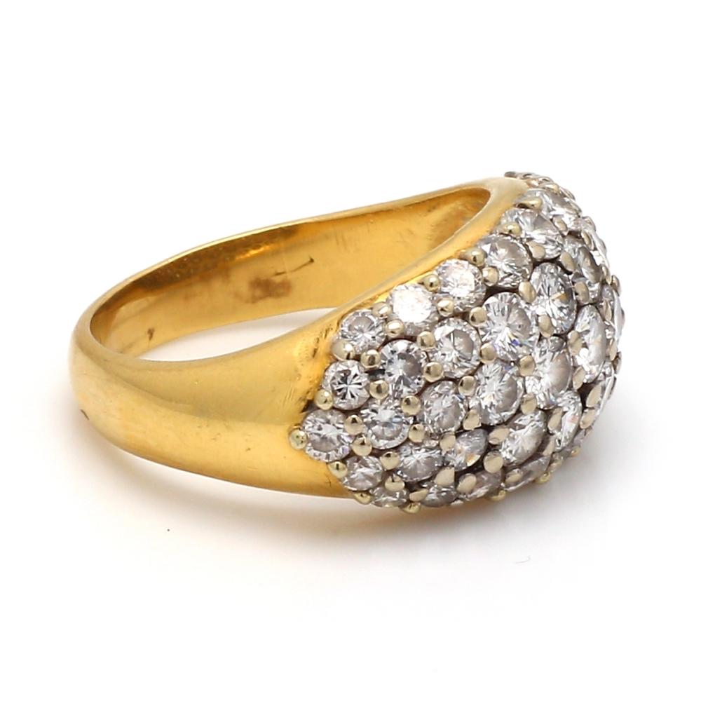 Gold Ring with Round Cut Diamonds

This luxurious gold ring showcases an array of round cut diamonds, each with a captivating white hue and VS1 clarity. The diamonds are meticulously set in 18k gold, creating a dazzling display of brilliance.