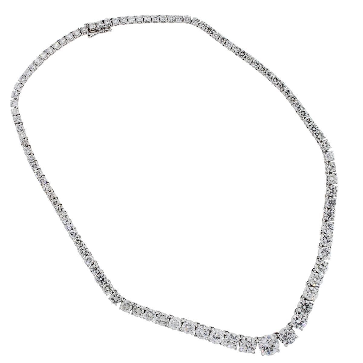 Material: 18k white gold
Diamond Details: Approximately 31.50ctw of round brilliant diamonds. Center diamond is 2.31 carat. Diamonds are F in color and SI1 in clarity
Measurements: Necklace measures 17″ in length
Clasp: Tongue in box with safety