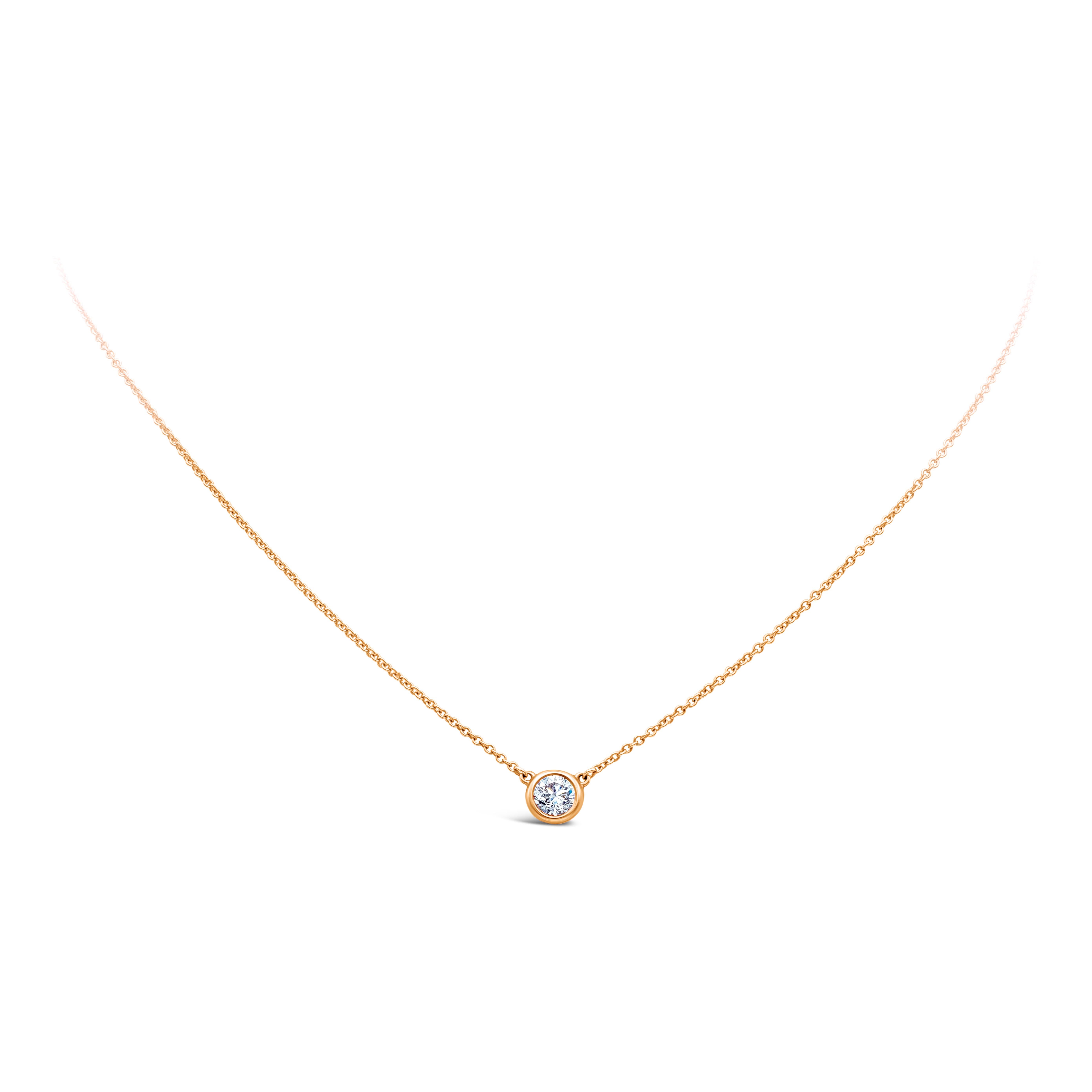 This necklace speaks simplicity. Perfect for everyday wear. Solitaire pendant necklace showcasing a single 0.47 carat round diamond G color and VS in clarity, made with 18 karat rose gold bezel set. Attached to a 16 inch with an interval at 15 inch