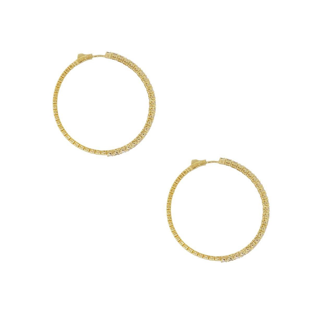 Material: 14k yellow gold
Diamond Details: Approximately 4.56ctw of round brilliant diamonds. Diamonds are G/H in color and VS in clarity.
Measurements: 2″ x 0.12 x 2″
Earrings Backs: Hoop
Total Weight: 14.5g (9.3dwt)
Additional Details: This item