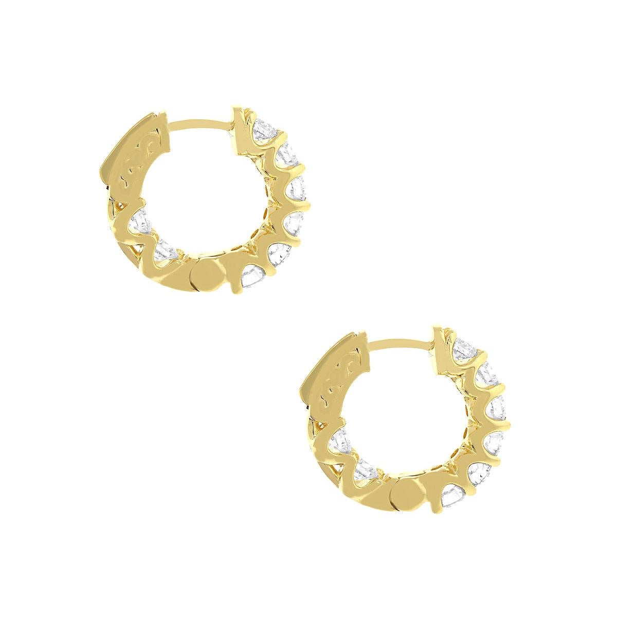 Material: 14k Yellow gold
Style: Diamond inside out hoop earrings
Diamond Details: 18 Stones, approximately 1.7ctw of round brilliant diamonds. Diamonds are G/H in color and VS in clarity.
Earring Measurements: 0.75″ x 0.20″ x 0.75″
Total Weight: