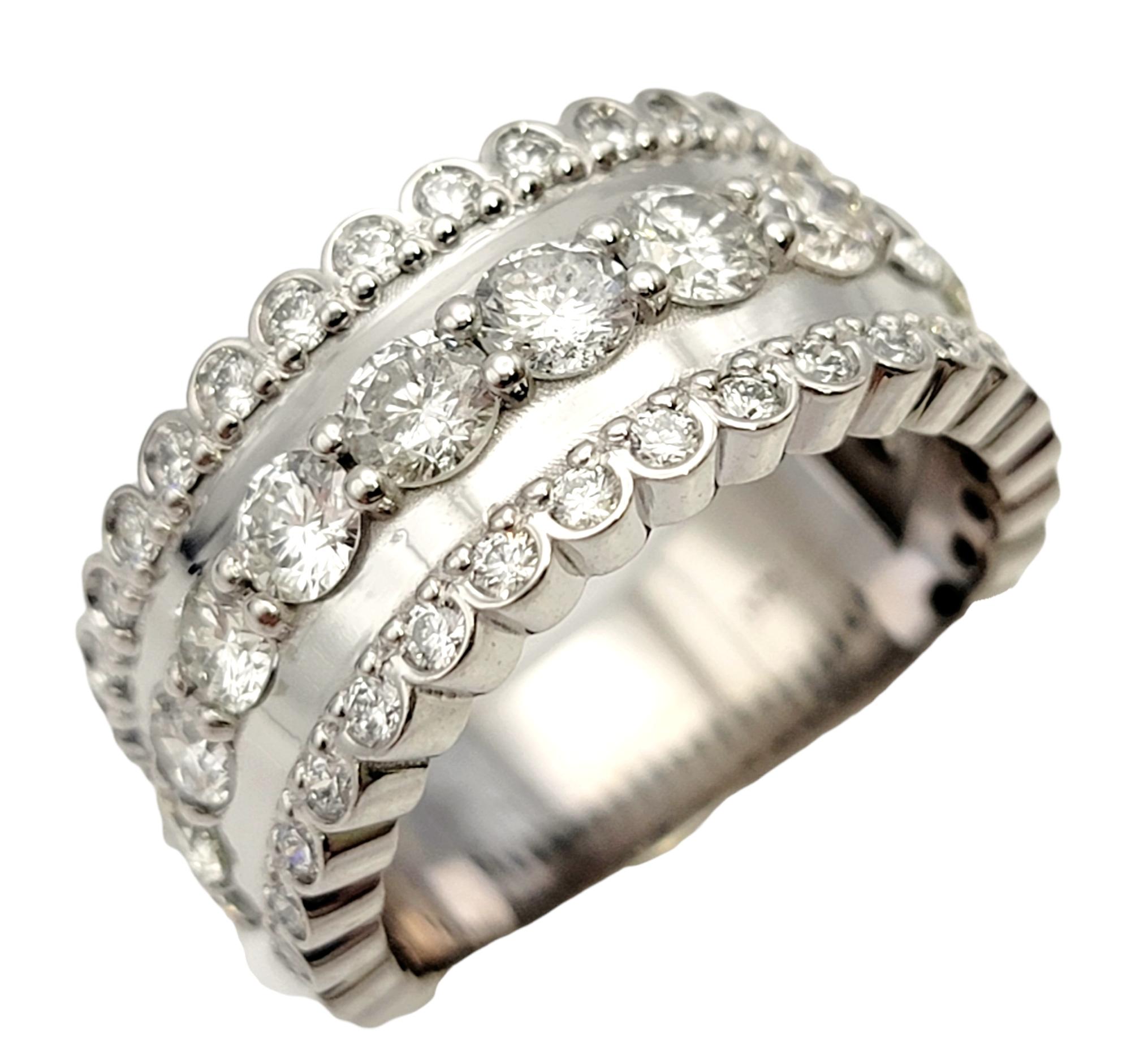 Ring size: 7.25

Stunningly sparkly diamond semi-eternity band ring. This gorgeous ring features 1.85 carats of bright, icy white pave diamonds set in 3 rows in a highly polished 14 karat white gold setting. The center row features the largest of