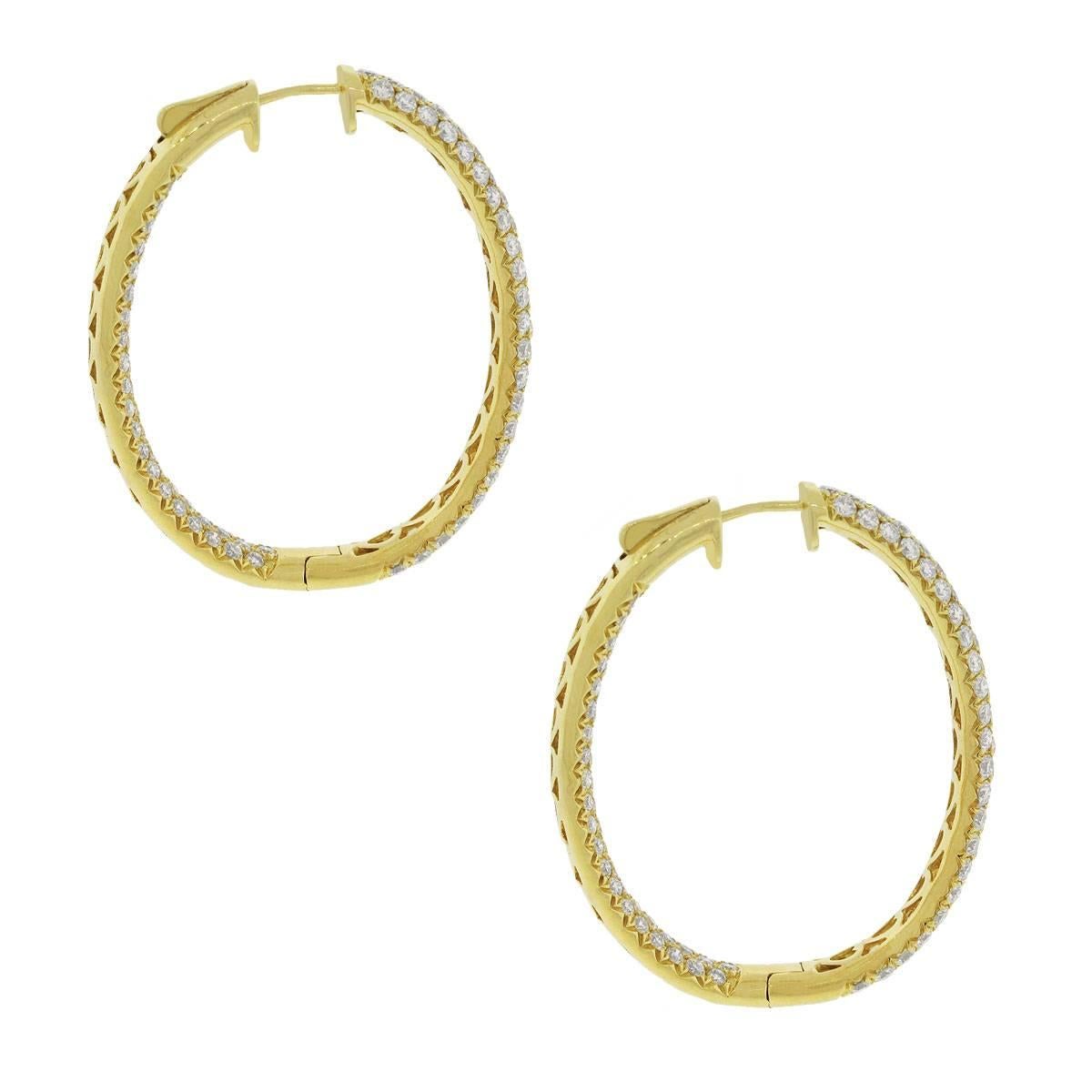 Material: 18k yellow gold
Style: Diamond inside out hoop earrings
Diamond Details: Approximately 7.39ctw of round brilliant and baguette diamonds. Diamonds are G/H in color and VS in clarity.
Earring Measurements: 0.51″ x 0.47″ x 0.98″
Total Weigh: