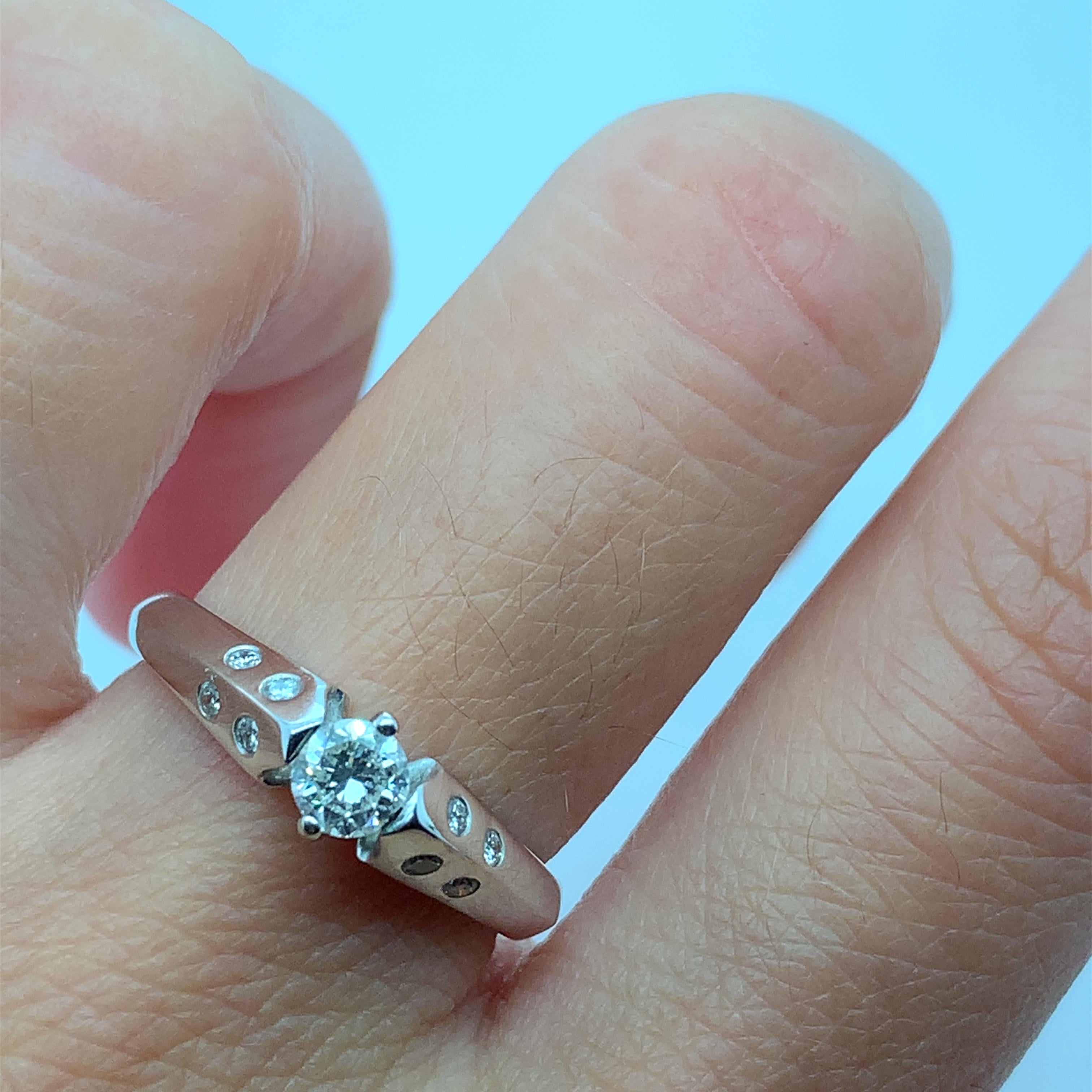 This beautiful 0.30ct diamond chunky solitaire engagement ring is a true masterpiece. Crafted from 18ct white gold, it features a round diamond with a fancy light colour intensity and a total carat weight of 0.30. The diamond is set in a solitaire